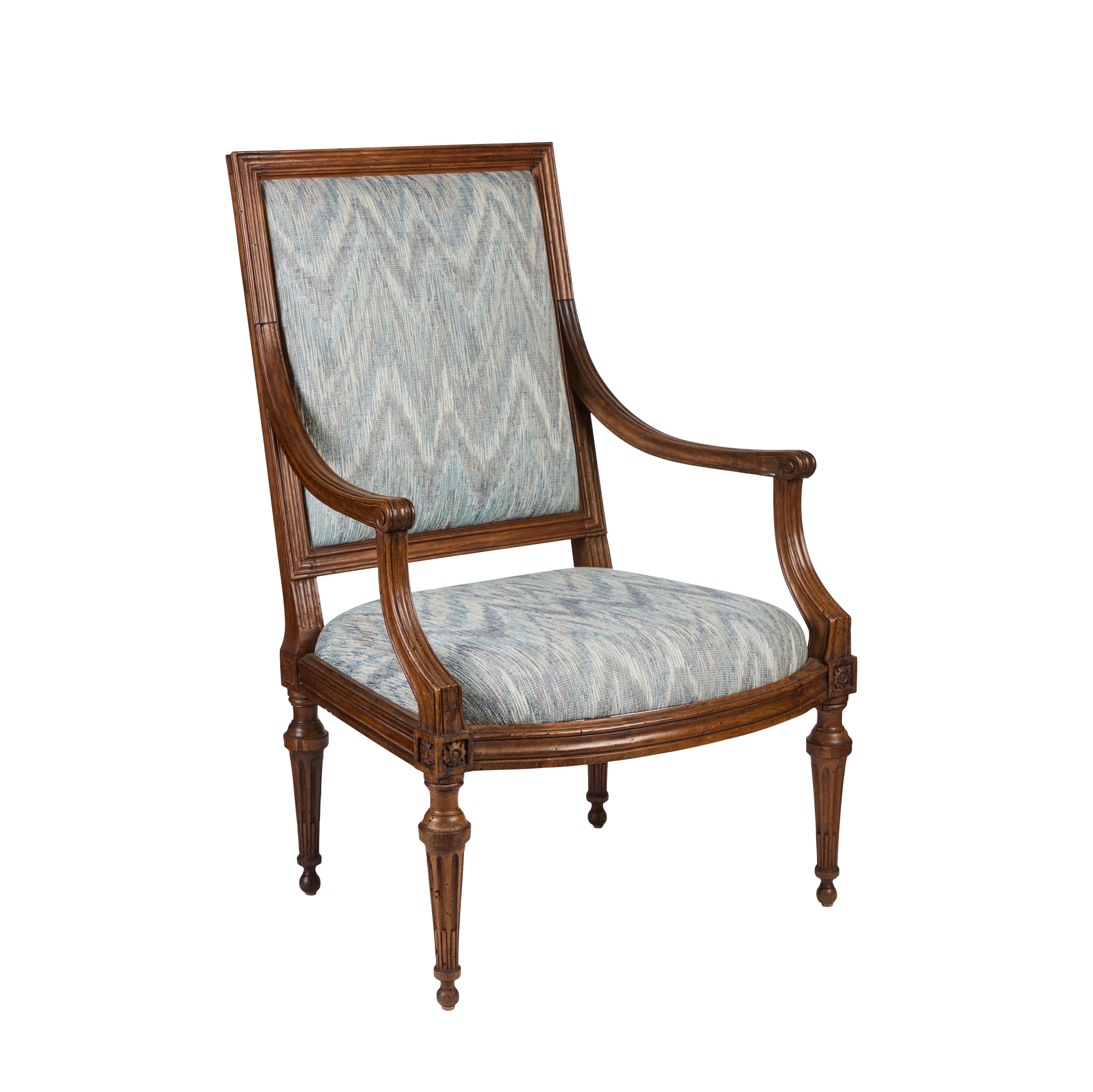 A handsome pair of hand-carved, walnut armchairs, recently upholstered in a cotton, flame stitch Cowtan and Tout fabric.