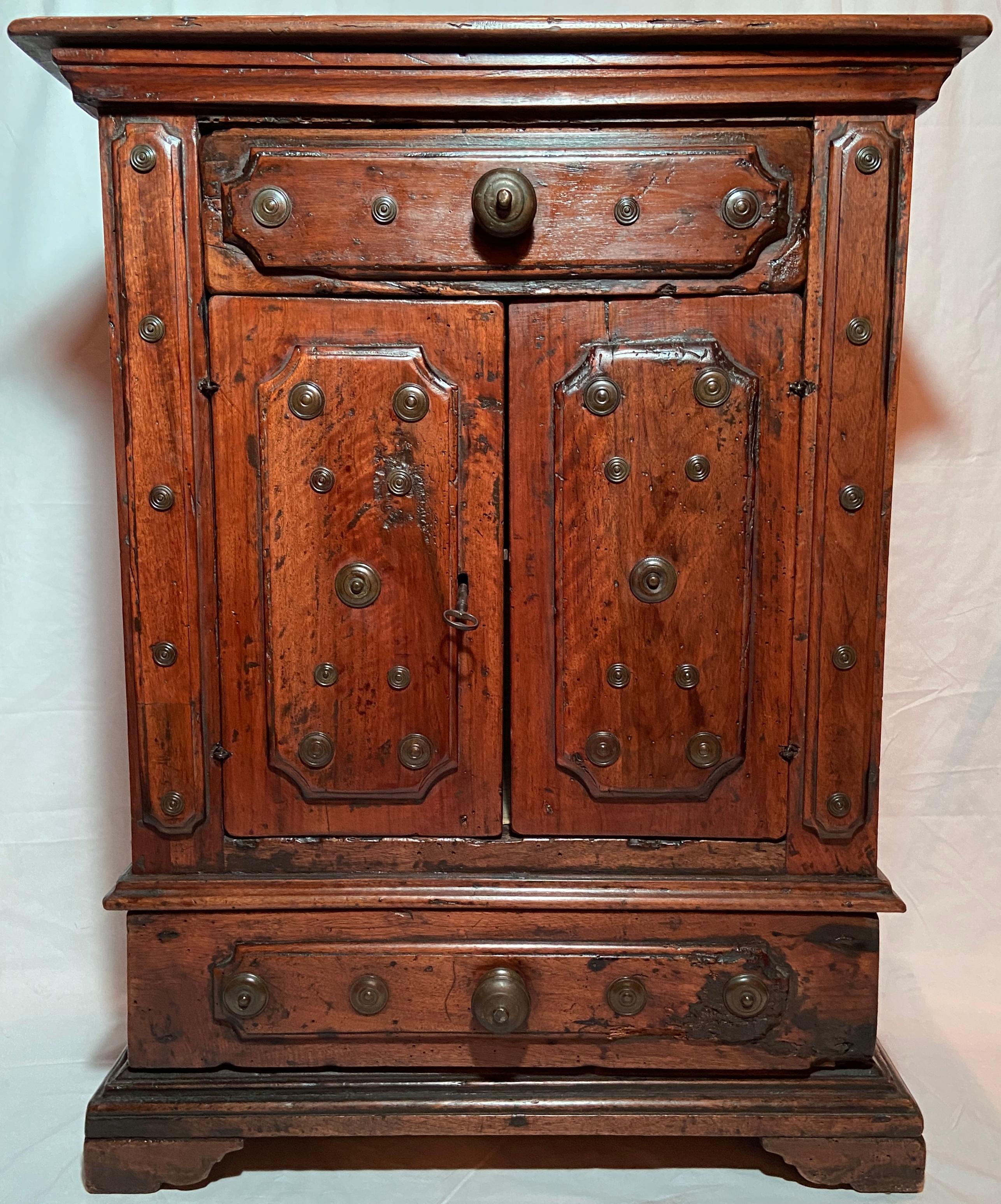 Pair Antique Italian walnut small cabinets with brass nailheads.