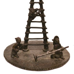 Pair of Antique Japanese Bronze Monkey Motif Candlesticks