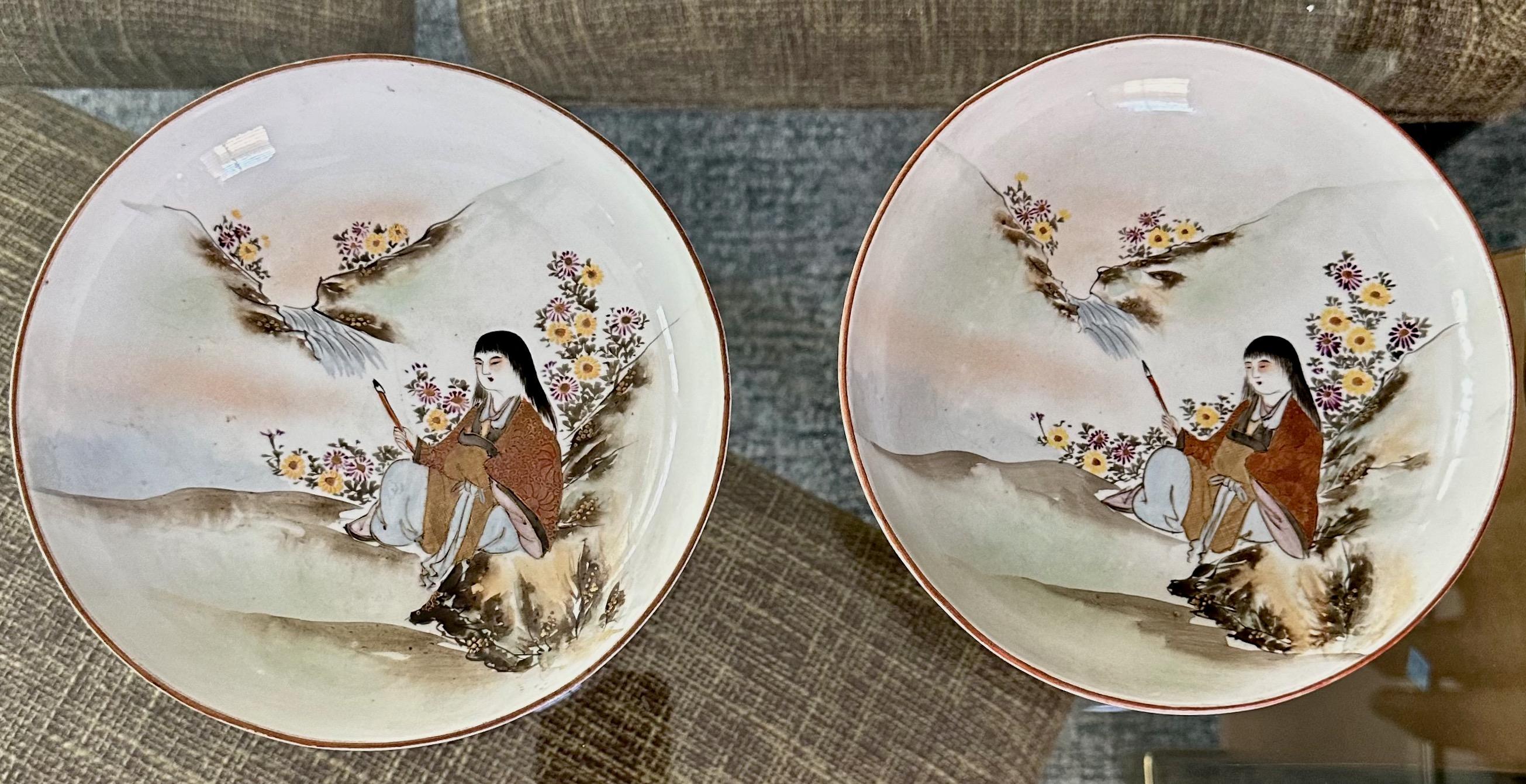 Pair antique Japanese early Meiji period Kutani Tsukuru (made at Kutani) porcelain painted bowls. Embellished with delicately hand painted women in mountain scenery and flowers. The colors are soft and expertly painted. Each woman's robe is painted