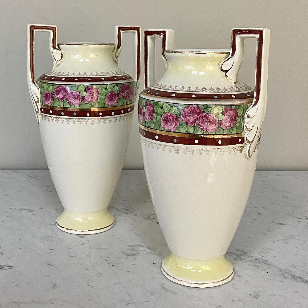 Pair Antique Keramis vases is a splendid example of craftsmanship from the famous maker out of Belgium, with a classical shape inspired by ancient Greek archeological treasures and a colorful display of roses and greenery with fine bordering. In