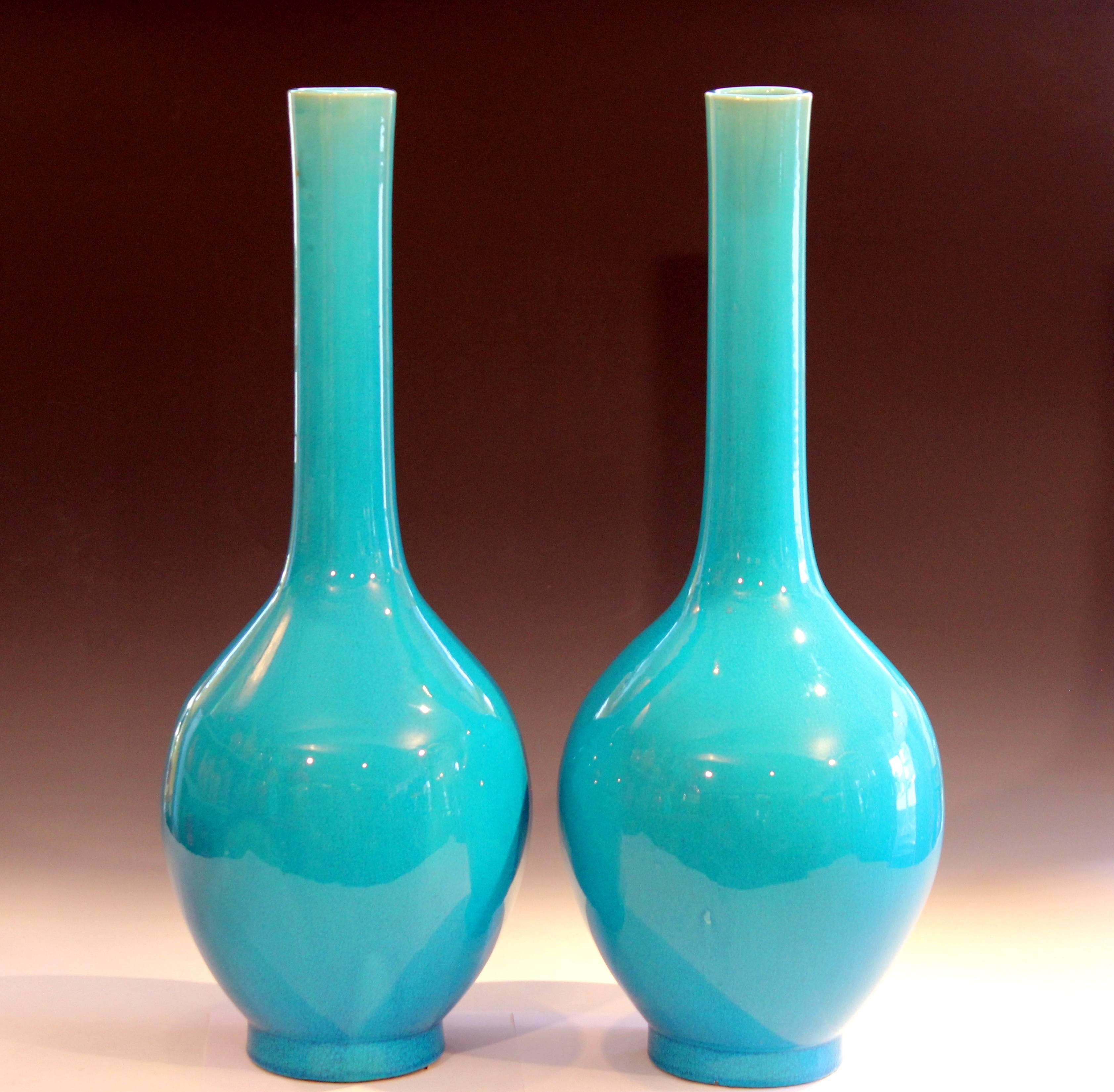 Large pair of antique Japanese Awaji type bottle vases from the city of Kyoto, circa 1910s. Sensuous forms with unusually brilliant and even turquoise crackle glaze. Measure: 24