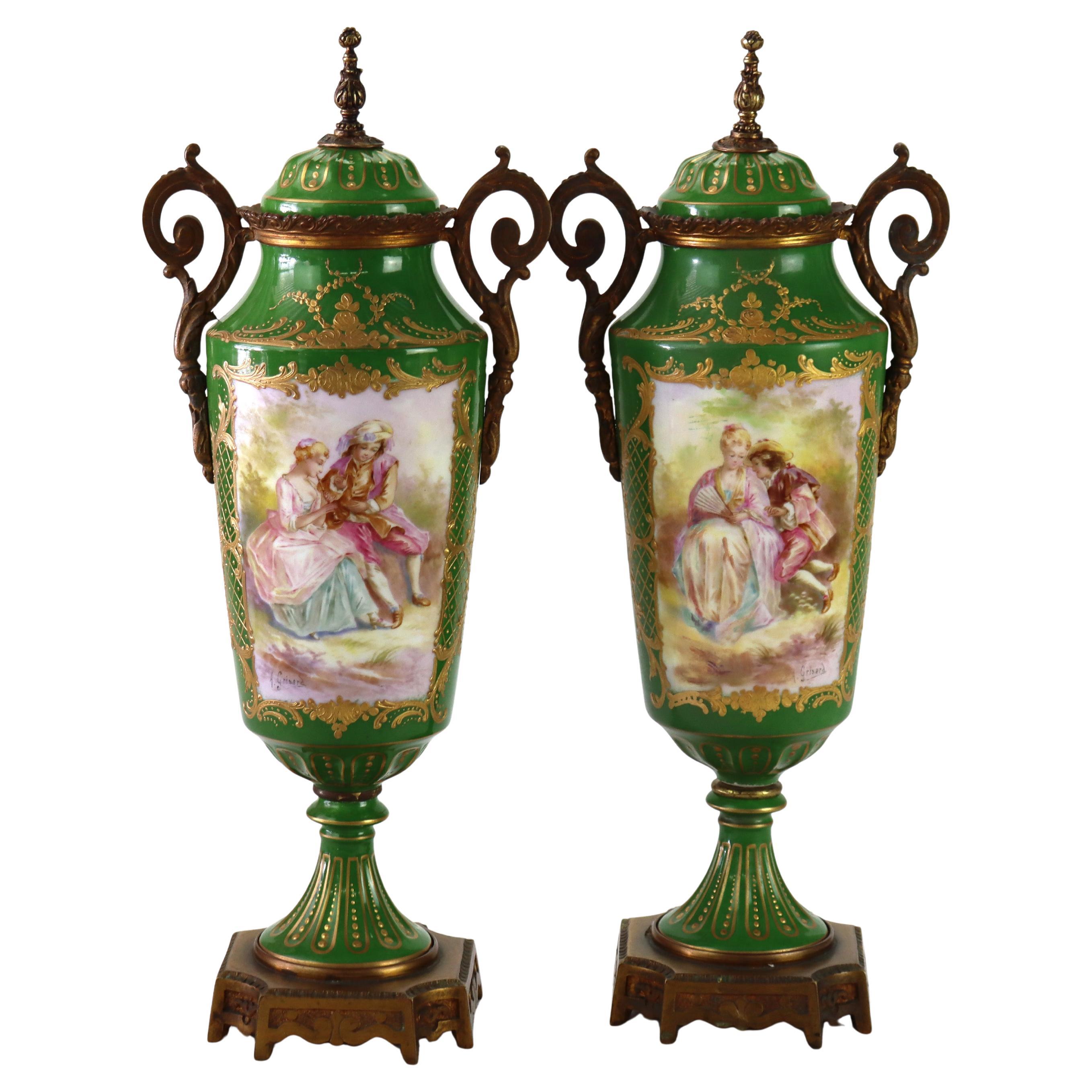 Pair Antique Limoges Porcelain
Ormolu Covered Urns With Genre Scenes c1890