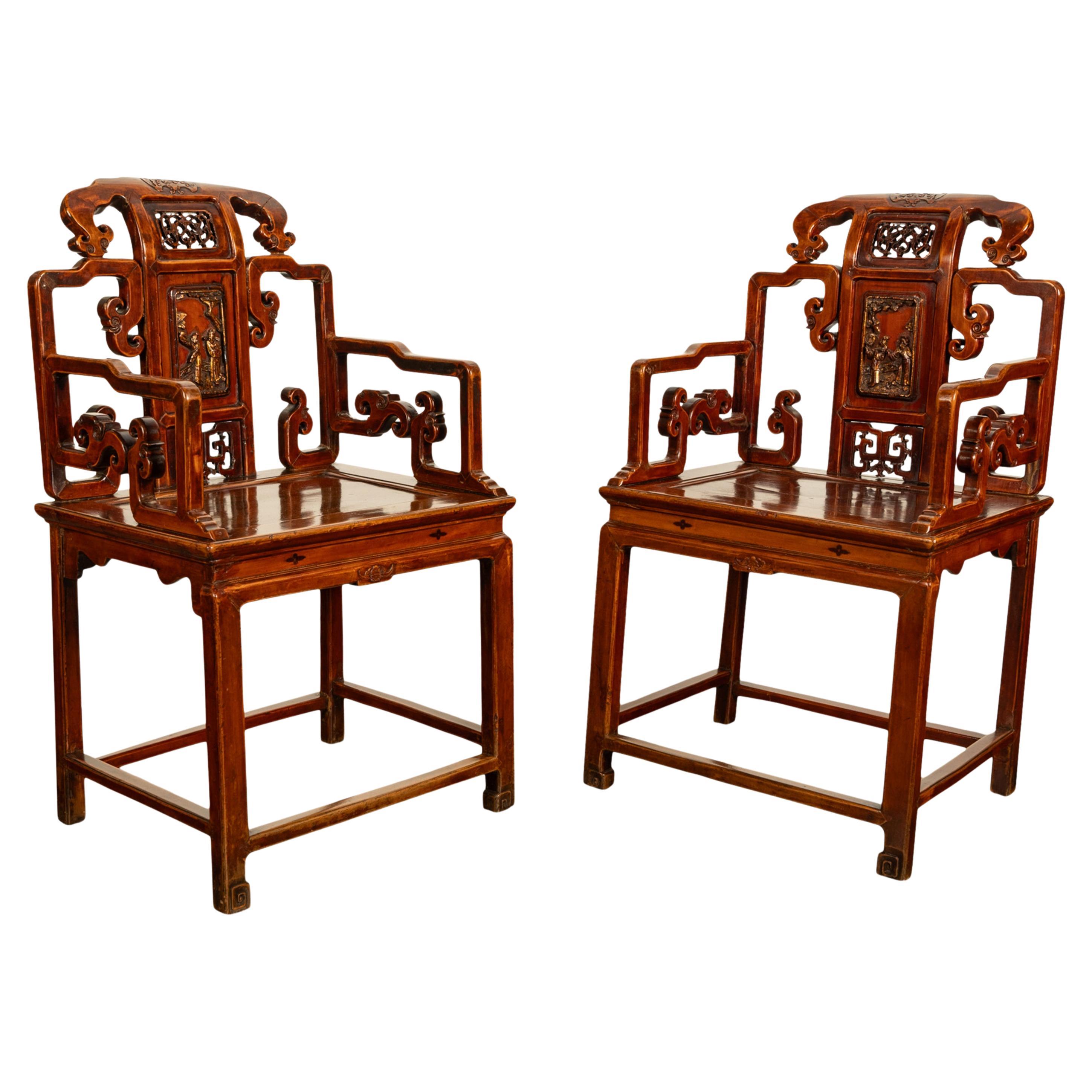 A fine pair of antique 19th Century Chinese Ming style carved, lacquered & gilt throne armchairs, Qing dynasty, circa 1860.
This very attractive pair of antique carved Chinese throne chairs are made from Chinese elm, with traces of red lacquer