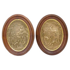 Coppia di antiche targhe da parete neoclassiche in bronzo a bassorilievo