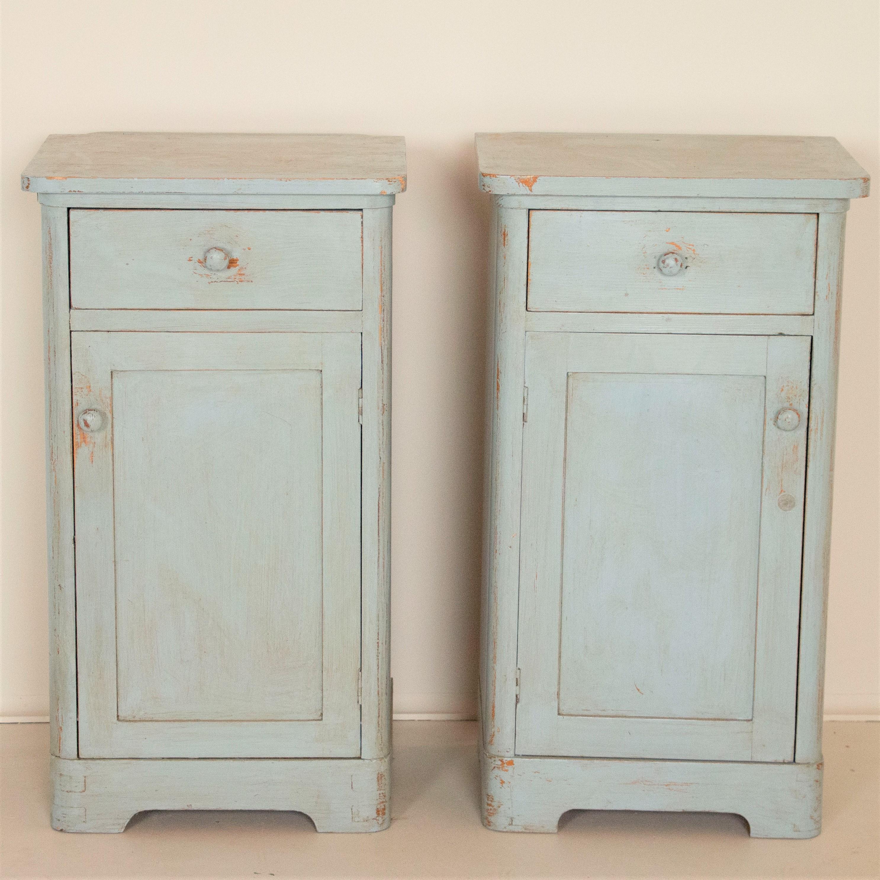 The light blue paint is all original in this pair of narrow nightstands. Perfect for use in a small room, the soft color is perfect for a variety of styles including cottage, farm house, coastal farmhouse or simply a guest or childs room. They have