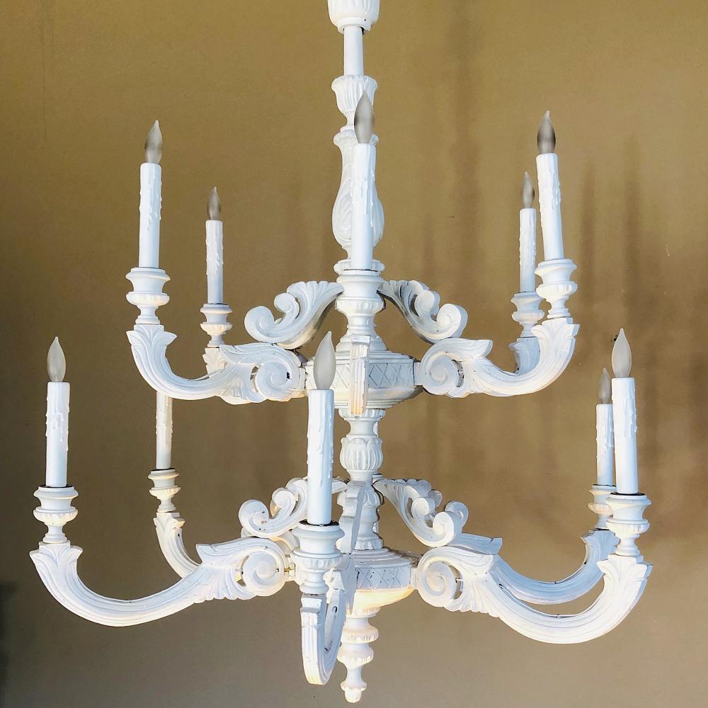 Pair of antique painted chandeliers are a rare find, especially with the two tiered design and naturalistic motifs enhanced by a patinated painted finish! Hand carved from solid wood, they are surprisingly light in weight and easy to hang.
Price