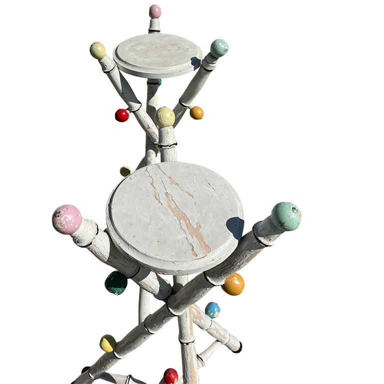 This extraordinary pair of painted tripod accent tables captures the spirited artistry and playful sophistication that defined the collection of Jonathan Parks, the late Santa Fe tastemaker and design collector known for his eye for the