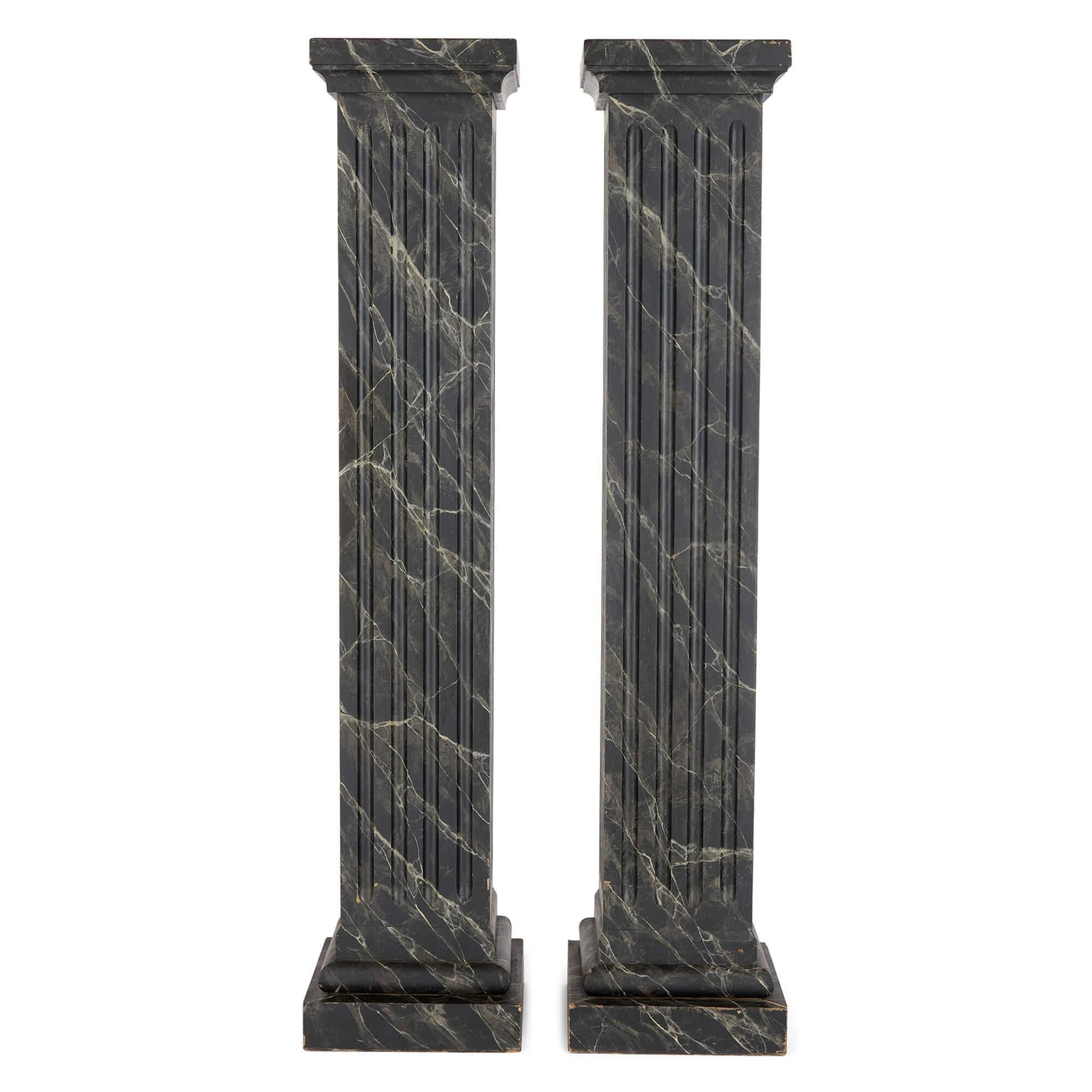 Pair Antique Painted Wood Marble Trompe L’Oeil Pedestals Stands Columns
Continental, Early 20th Century 
Height 153cm, width 33cm, depth 33cm

Dating from the early 20th century, this pair of columns takes its cues from classical architecture.