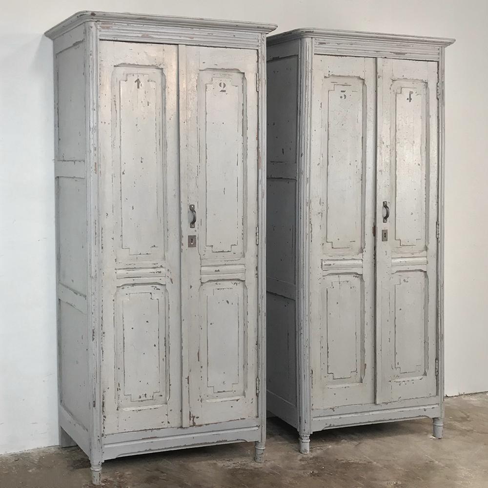 Pair of antique painted wooden locker cabinets are a truly rare find, and the stenciled numbers are still evident on the patinaed painted finish! Perfect for creating symmetry or just a lot of convenient storage for any room.

circa