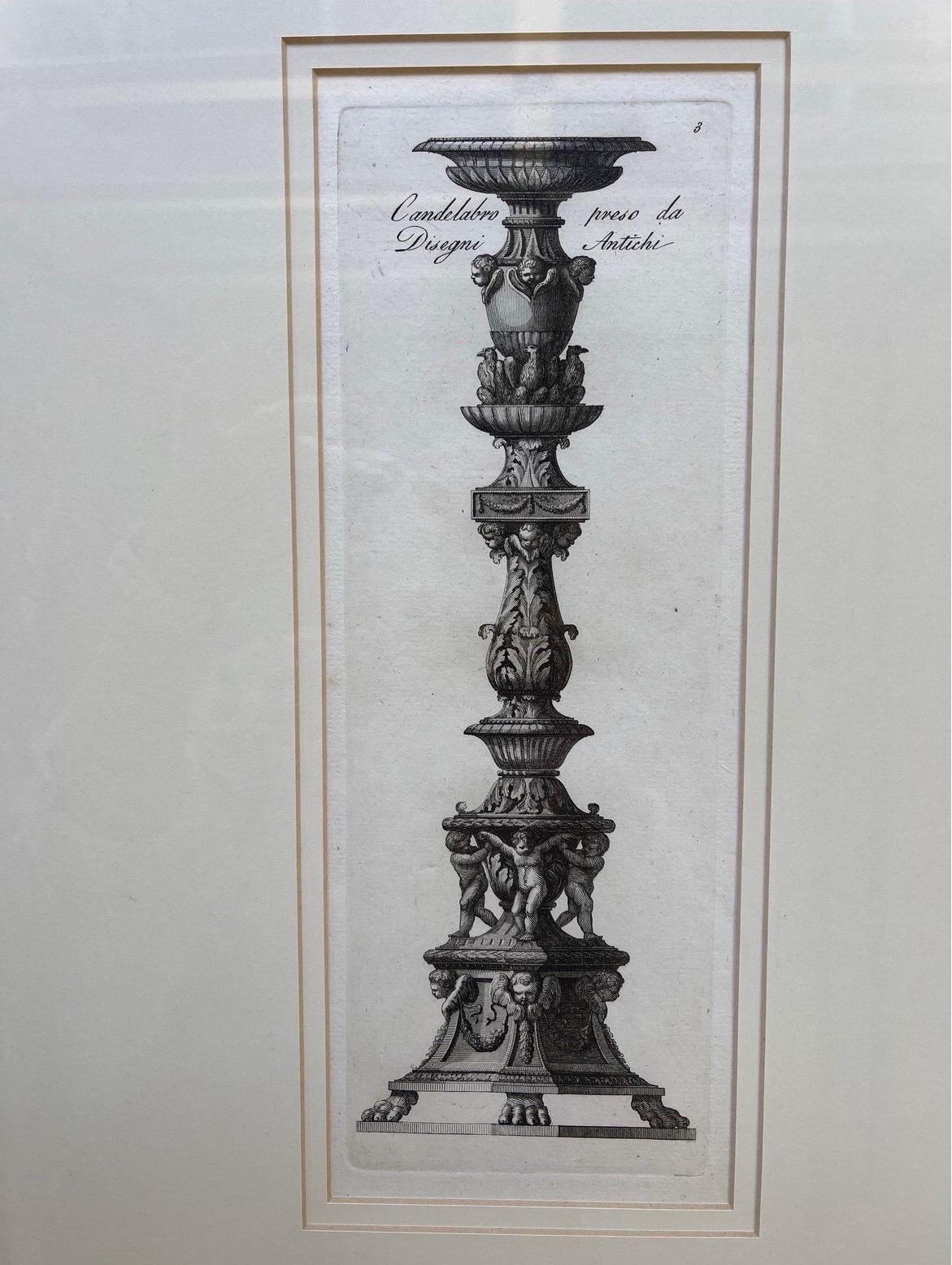 A pair of antique engravings of carved wood candlesticks in the baroque taste. Expertly framed and ready for hanging.