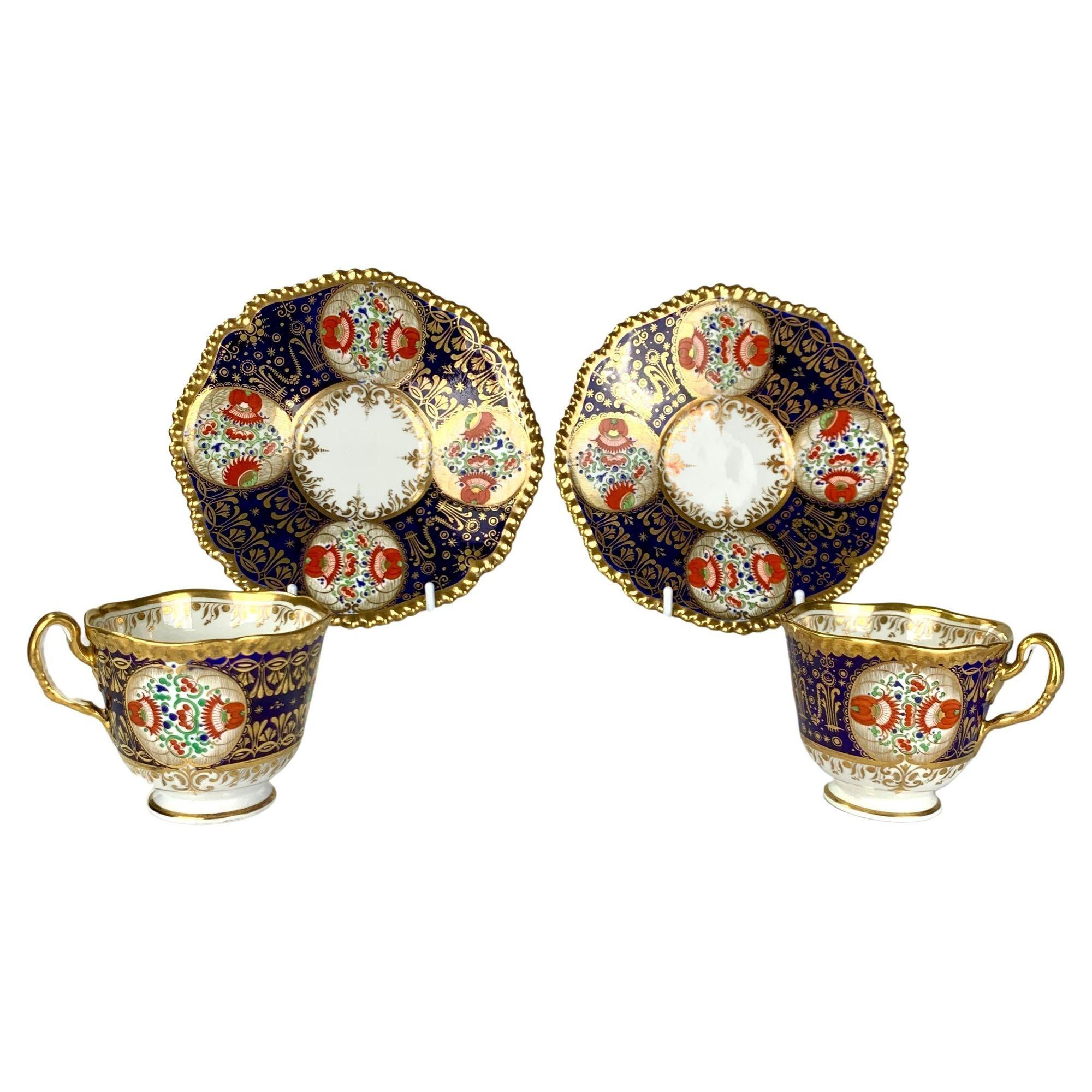 This pair of Worcester Porcelain cups and saucers was hand-painted in the Kakiemon style 