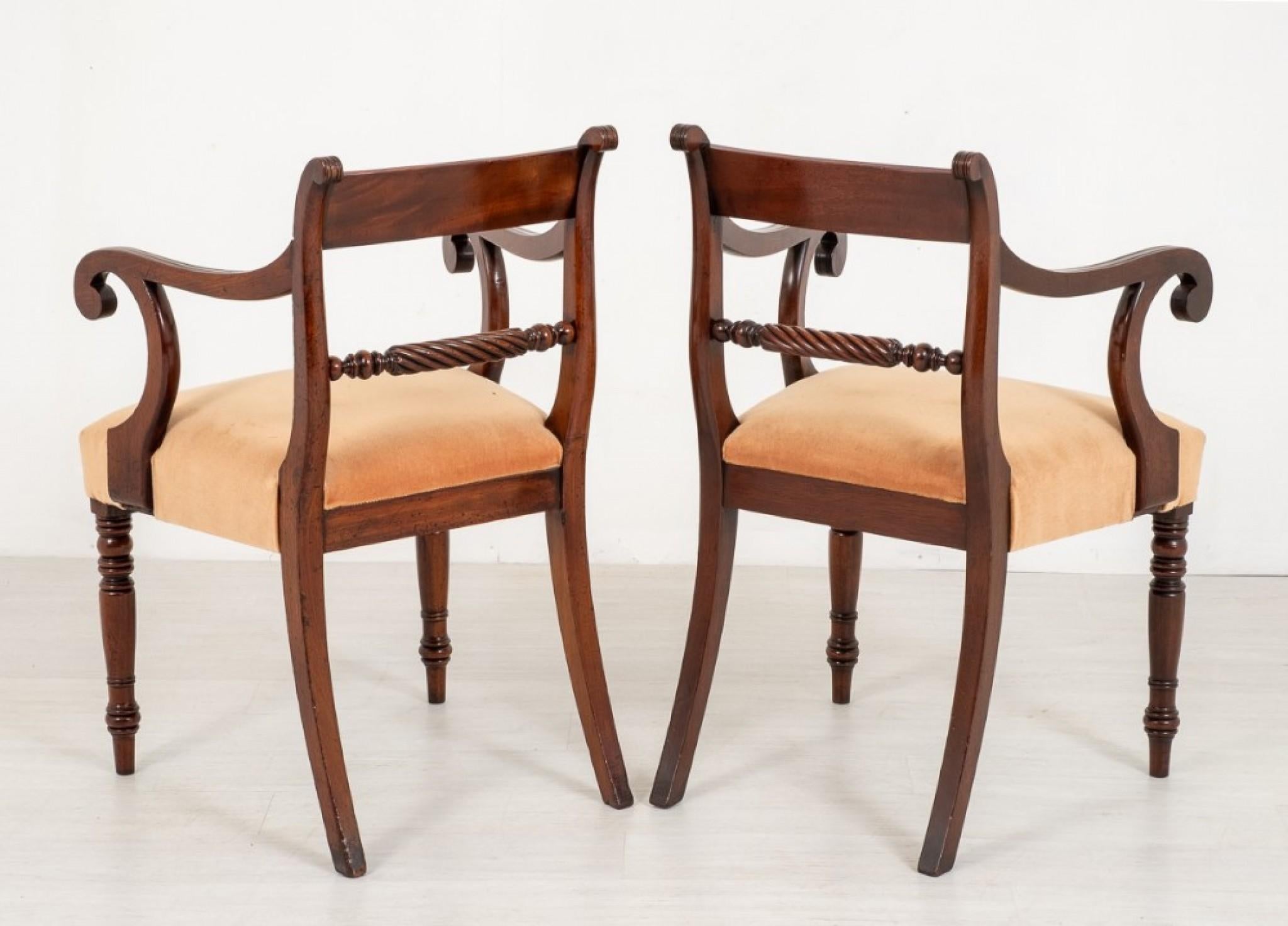 Pair of regency open arm chairs.
Having crisply ring turned front legs and swept sabre style back legs.
Featuring typical reeded regency shaped arm supports and elegant arms.
The top rails having highly figured timbers.
The lower rails being of