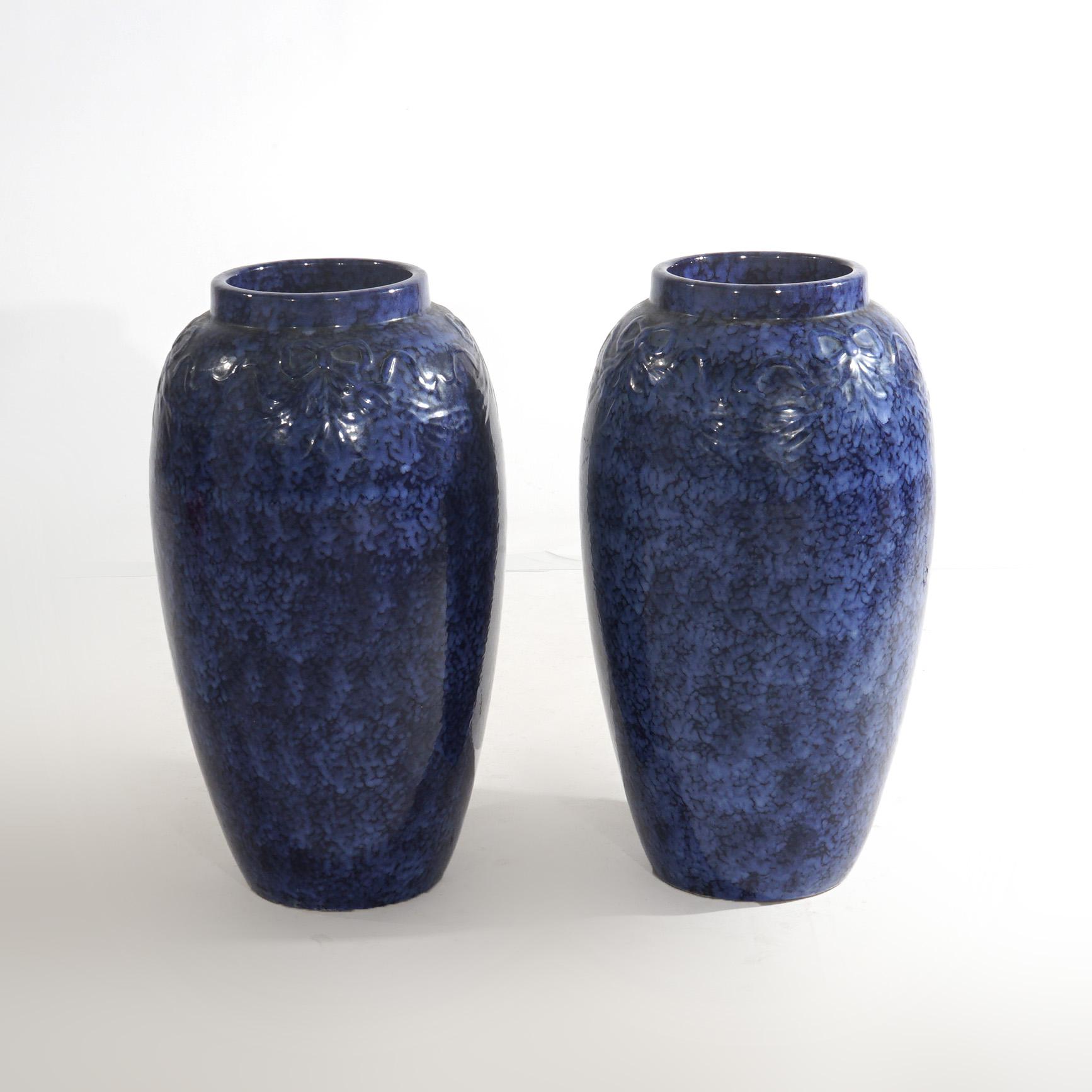 Pair Antique Roseville Art Pottery Floral Embossed Vases with Mottled Blue Glaze

Overall - 21 3/4