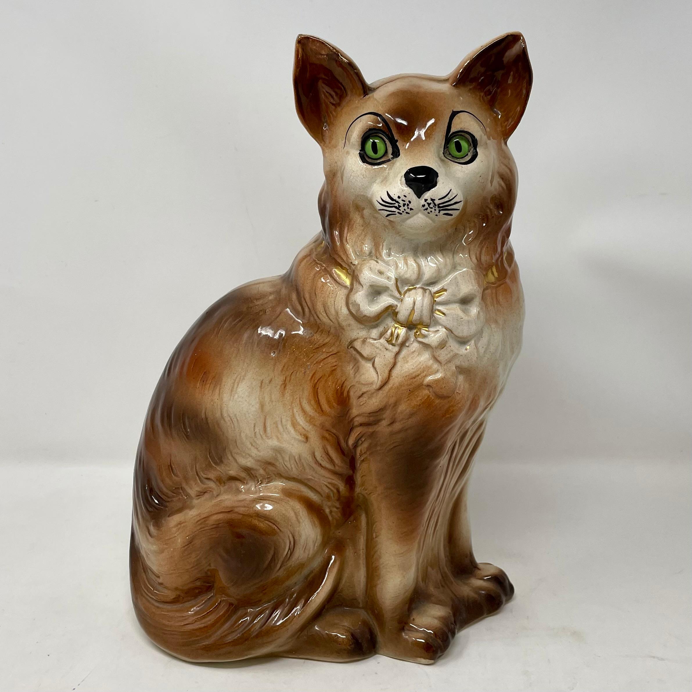 Pair antique Scottish Bo'ness pottery tabby cats with green glass eyes, circa 1880.

Bo'ness, Scotland (formerly-as Borrowstounness is the current name) port town where pottery was made 18th and 19th century.