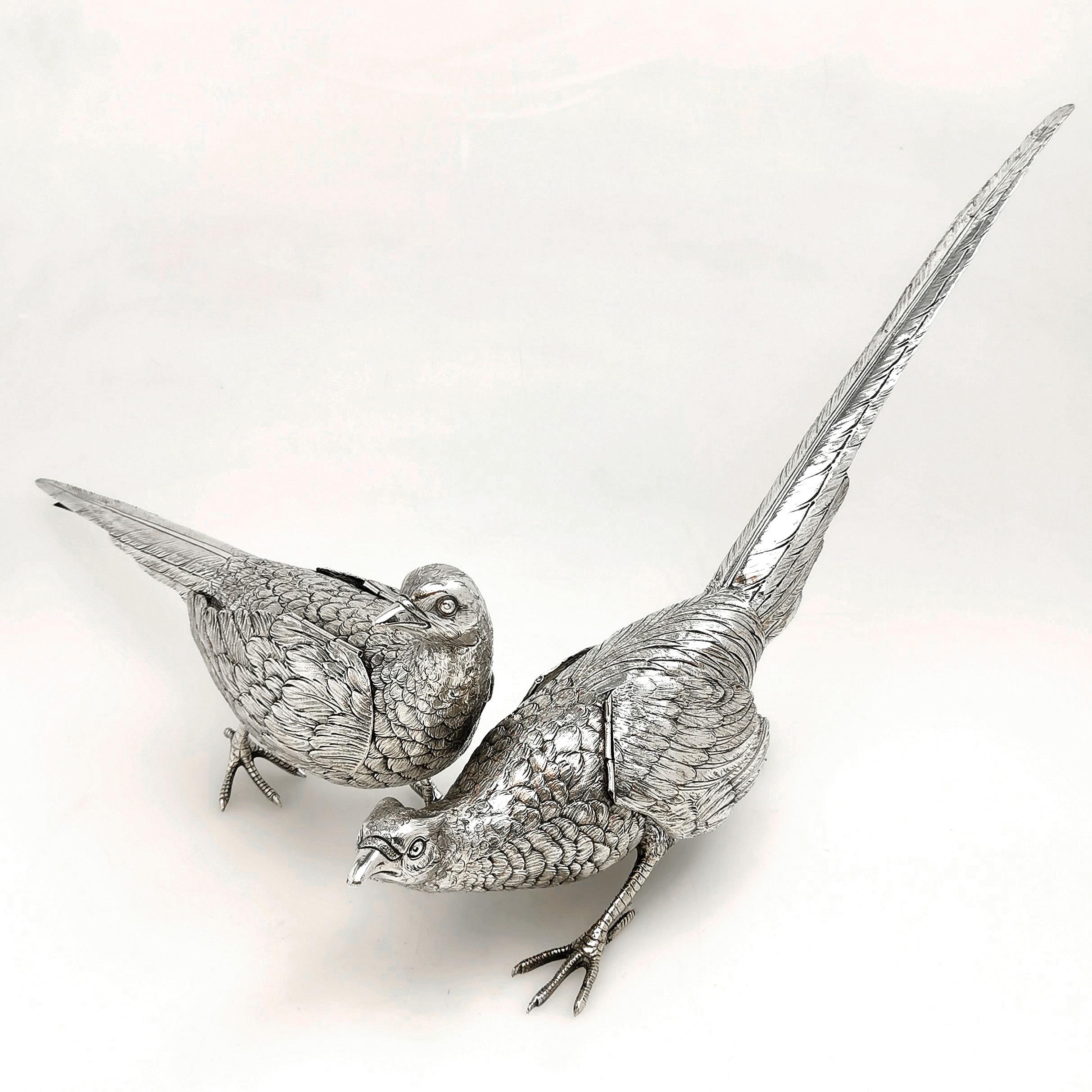A magnificent pair of Antique Solid Silver Pheasants of substantial size. These model Pheasants are created with a lovely attention to detail and each features a pair of hinged wings. Each Pheasant is unique - one is a cock and one a hen and each