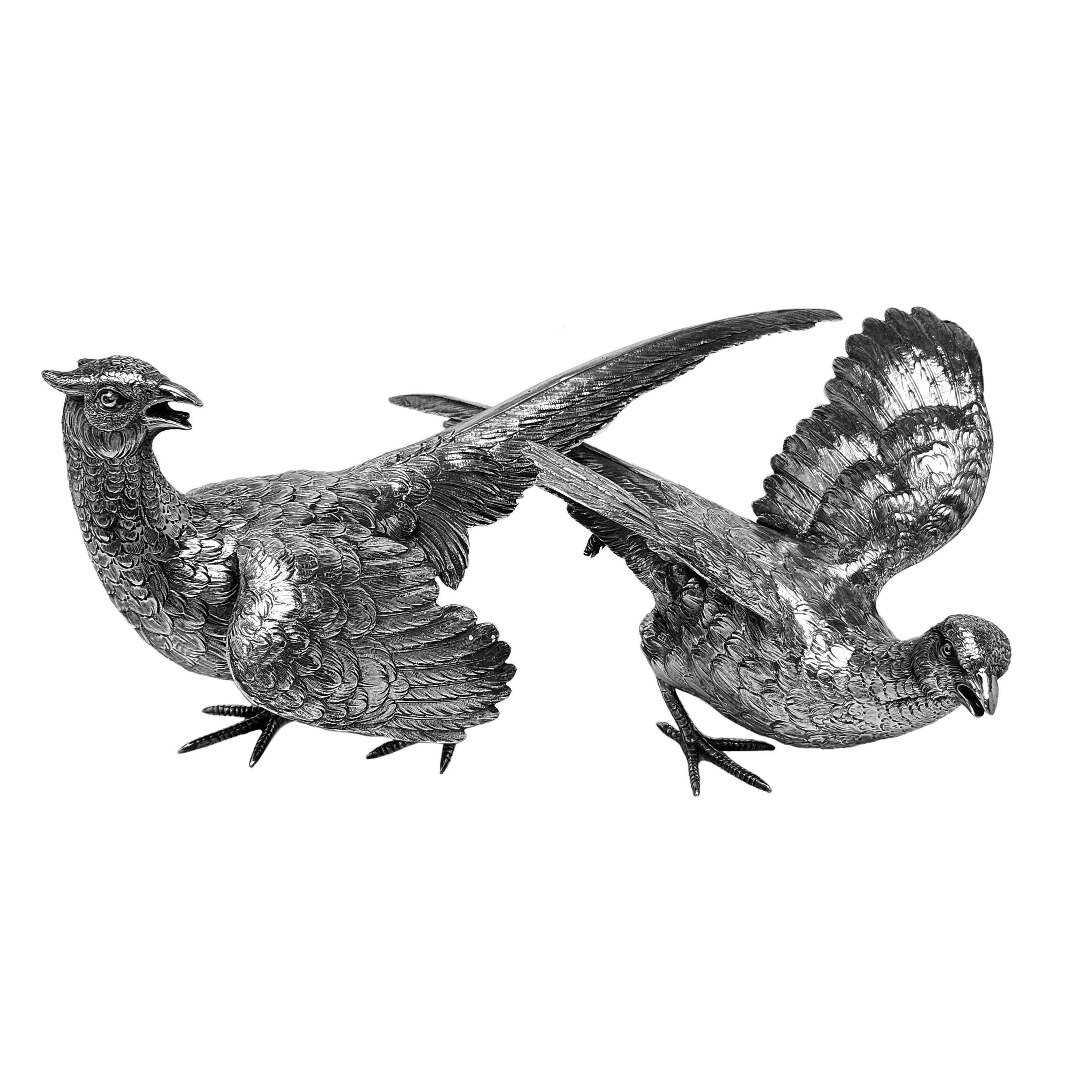 A pair of Antique Solid Silver Pheasants made in a classic style with a lovely attention to detail. The pair consists of a Cock Pheasant and a Hen Pheasant, each unique and modelled in individual poses.

Made in Germany in c. 1900.

Total Weight -