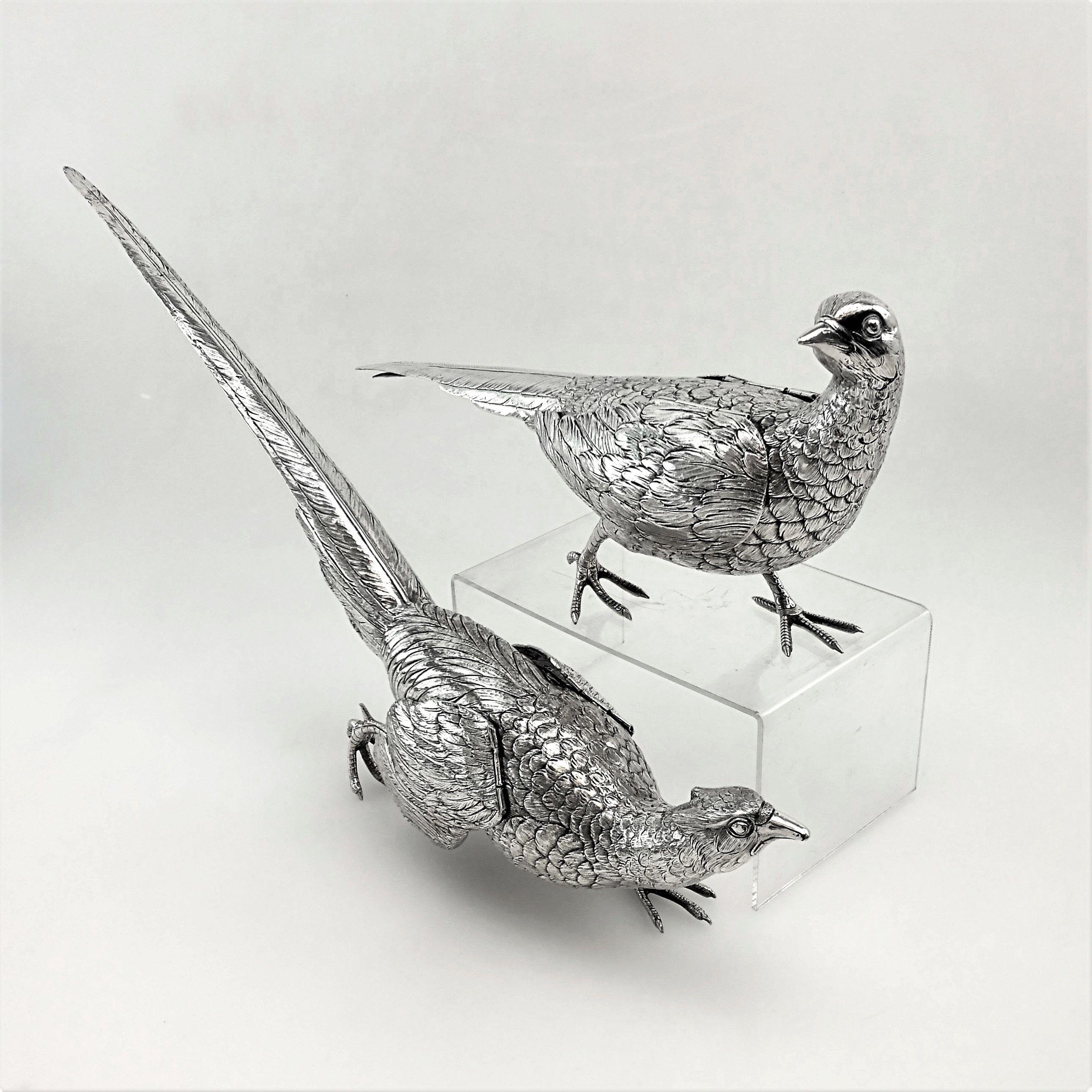 A magnificent pair of antique German solid Silver Pheasants created with a wonderful attention to detail. These Pheasants are of substantially large size and heavy weight and are excellent quality examples of these classic decorative items. These