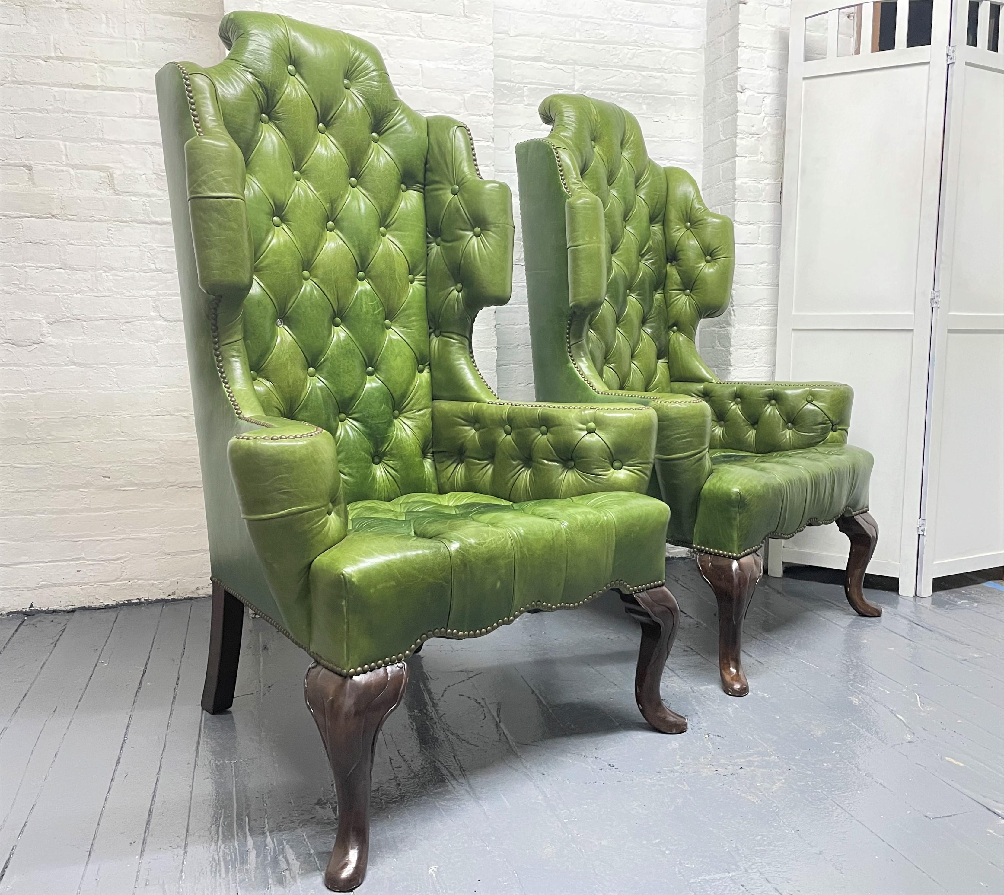 Pair antique style tufted leather wingback chairs. The chairs have Queen Anne style wood legs, nicely tufted with soft leather.