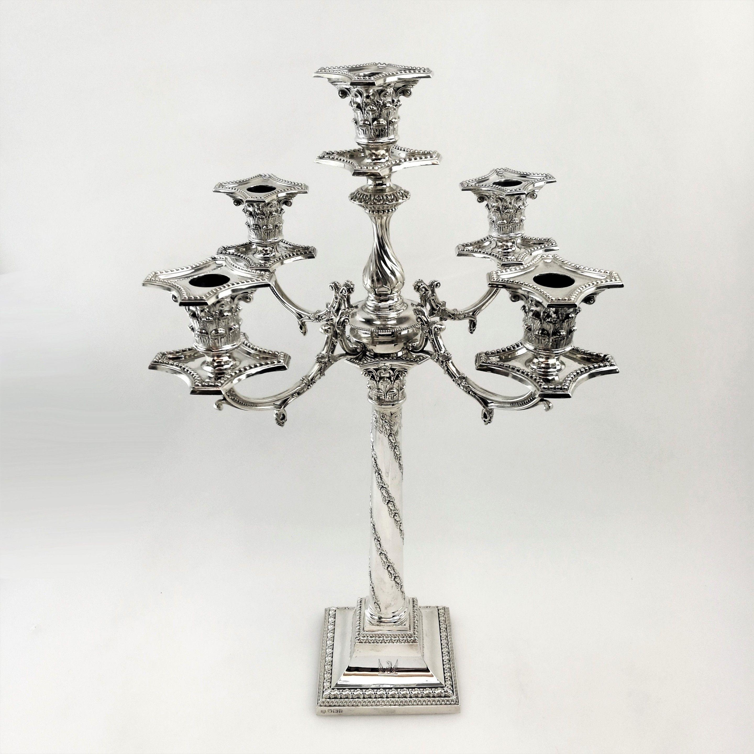 A magnificent pair of Victorian 5-light candelabra on substantial square bases and supported by oak wreath columns with Corinthian capitals. The ornate branches are topped with Corinthian capitals with push fit sconces embellished with a traditional