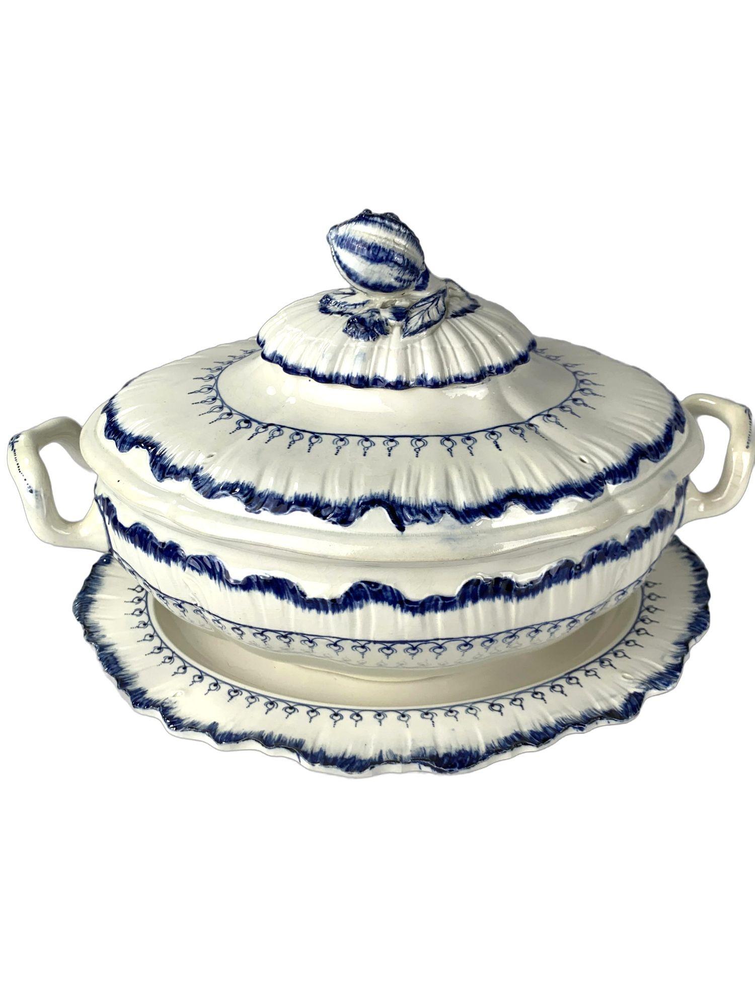This exquisite pair of Wedgwood blue and white Mared pattern soup tureens was made in England circa 1840.
The design features a loop of delicate 