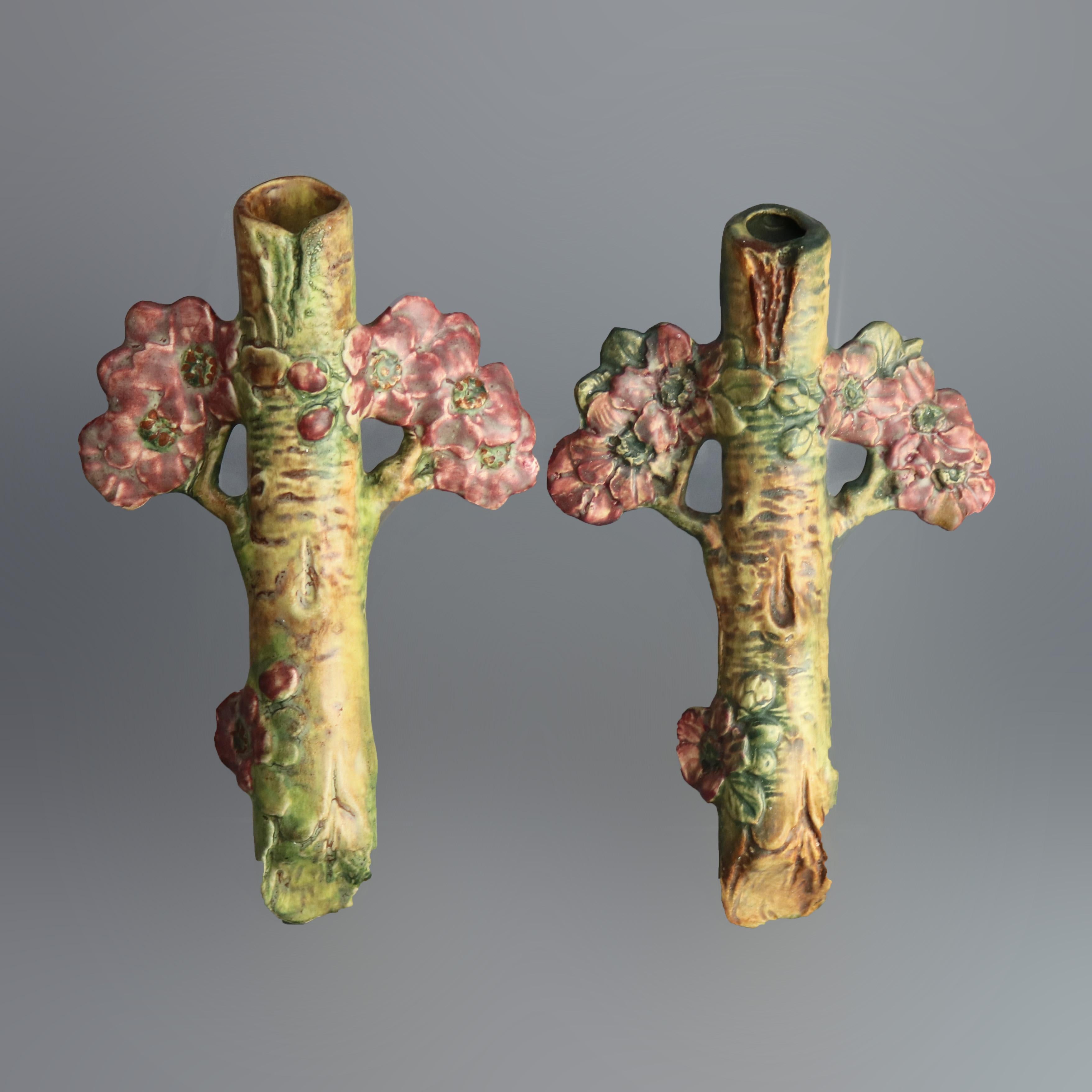 An antique pair of Weller Woodcraft art pottery wall pockets offer branch for with apple blossoms, marked as photographed, circa 1930

Measures: 9