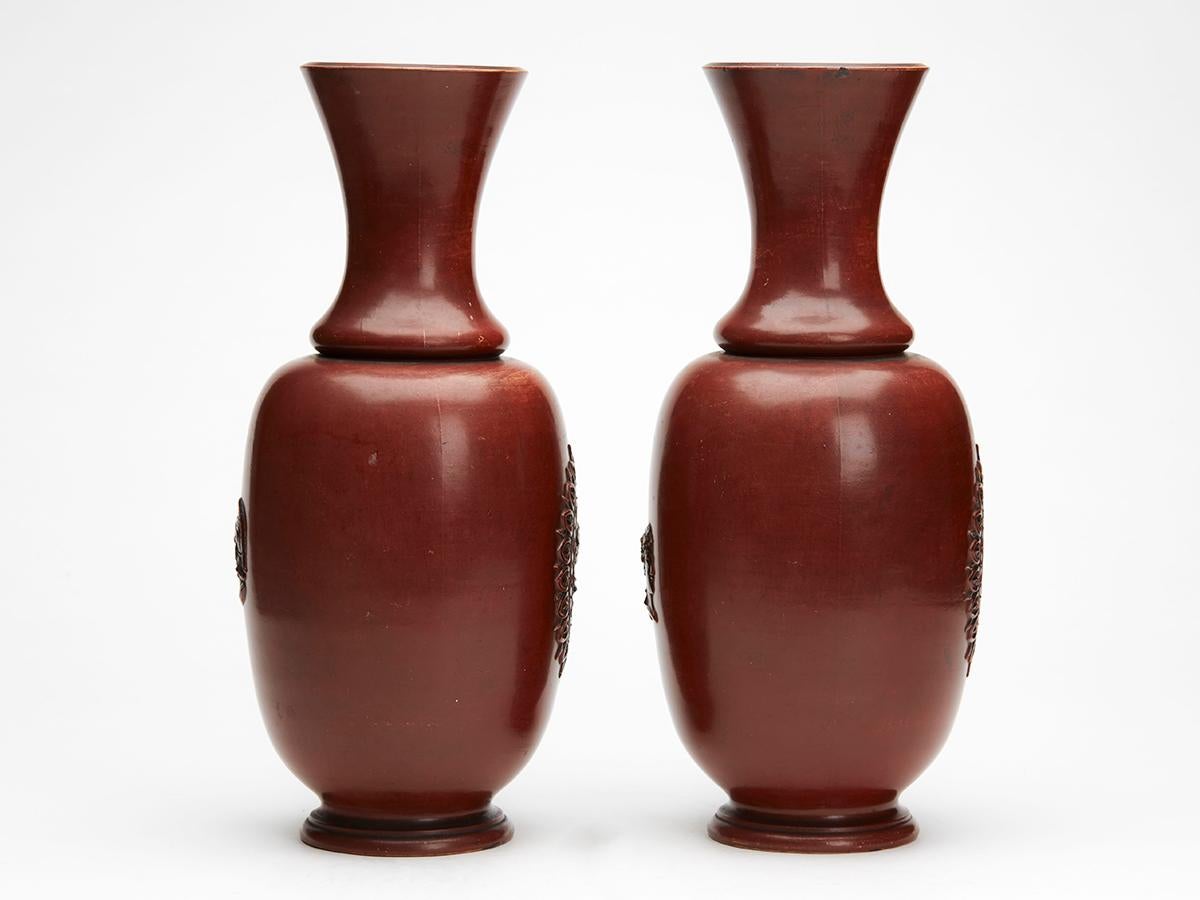 A fine and unusual antique pair vases with Roman cameo portraits by renowned Bodenbach potter Wilhelm Schiller. These large earthenware vase are of bulbous shape with shaped funnel style tops. The body of both vases has a cameo relief portrait of a