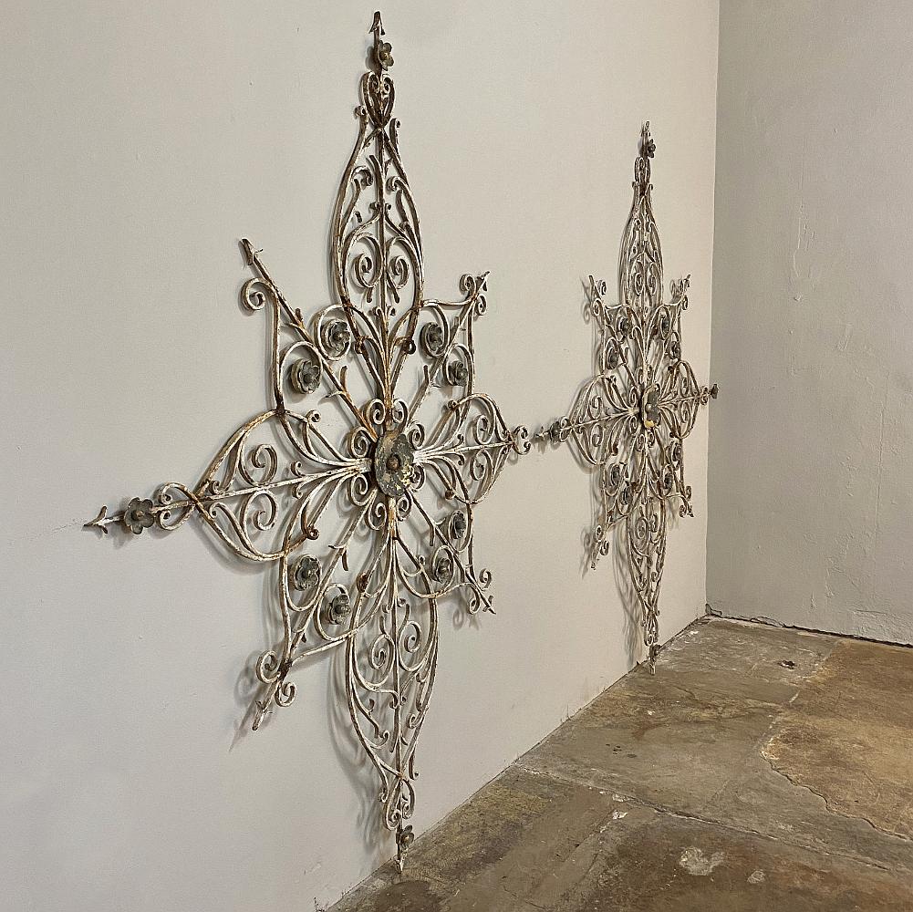 Pair Antique wrought iron decorative architectural panels are perfect for interior or exterior visual appeal! Intricate workmanship is abundant in the design, resembling an artistic compass rose. Rare to find in a pair!
Sold As Is ~ some minor