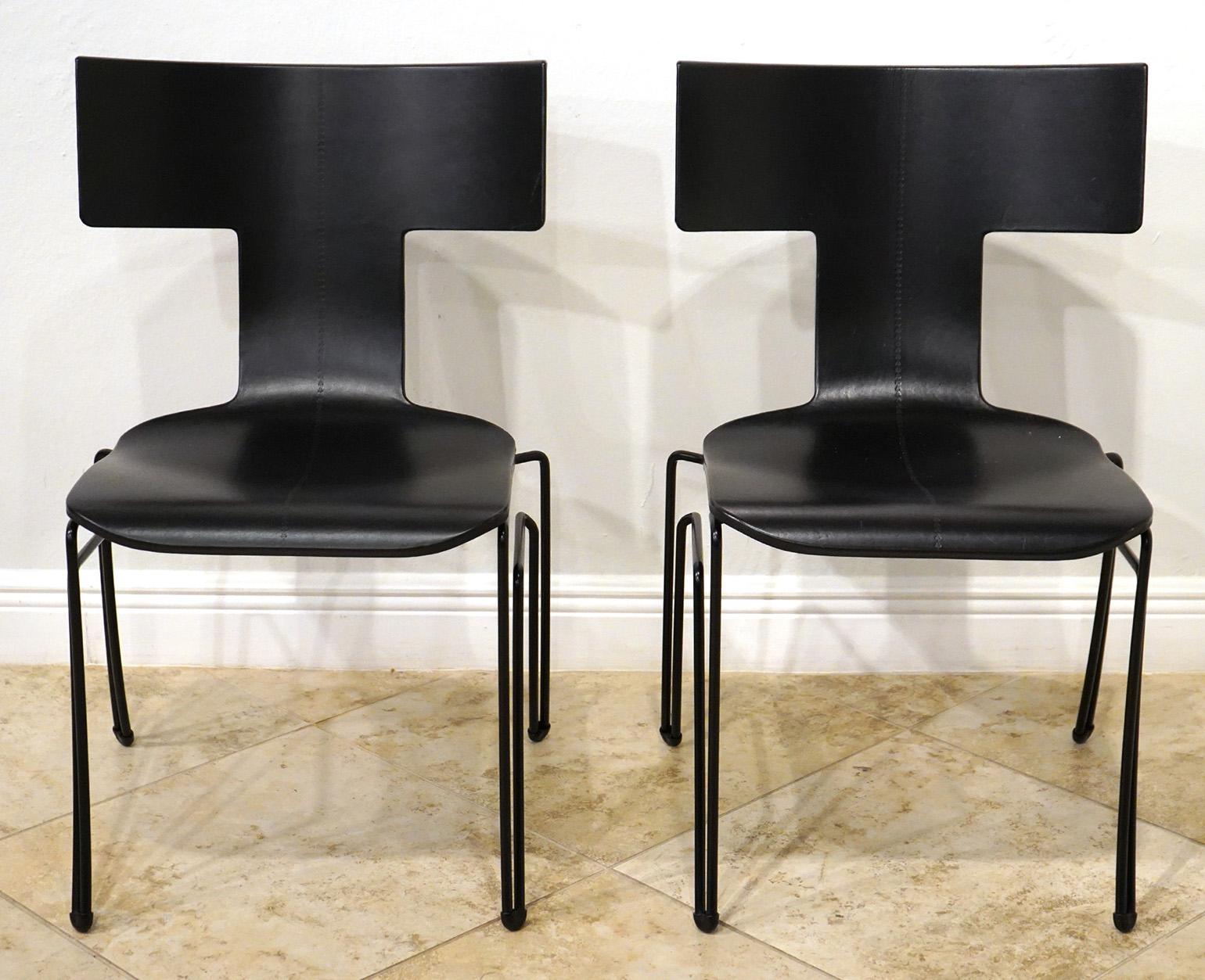 Pair of 'Anziano Klimos' chairs by John Hutton for Donghia. Marked on bottom. Price is for 2 chairs. Wrapped and embossed in black leather. Very good pre owned condition. 