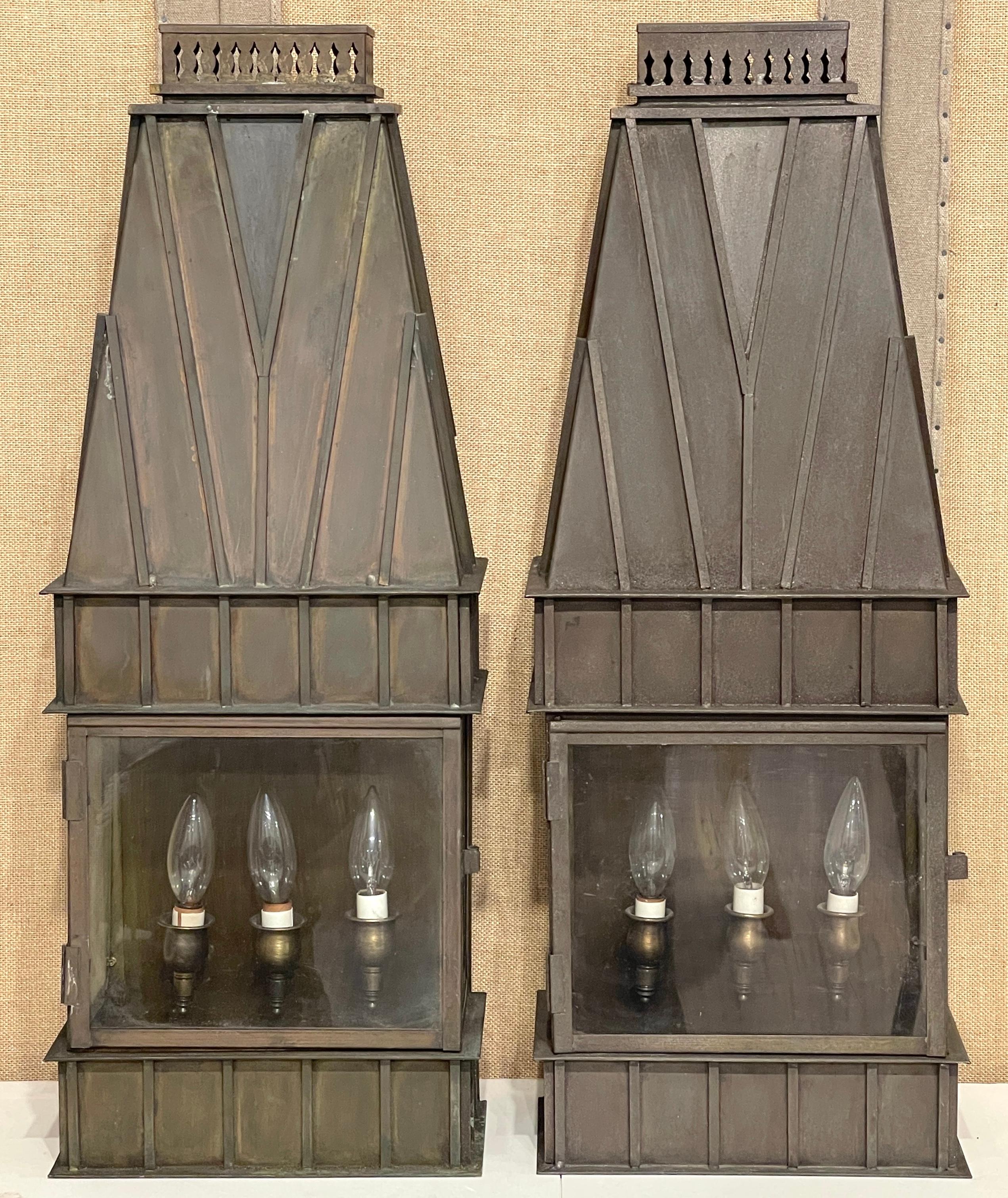 Pair of Architectural Georgian Gothic Bronze Exterior/Interior Wall Sconces 
USA, circa 1960s

A striking pair of architectural Georgian Gothic bronze exterior and interior wall sconces, crafted in the USA circa the 1960s. These sconces epitomize