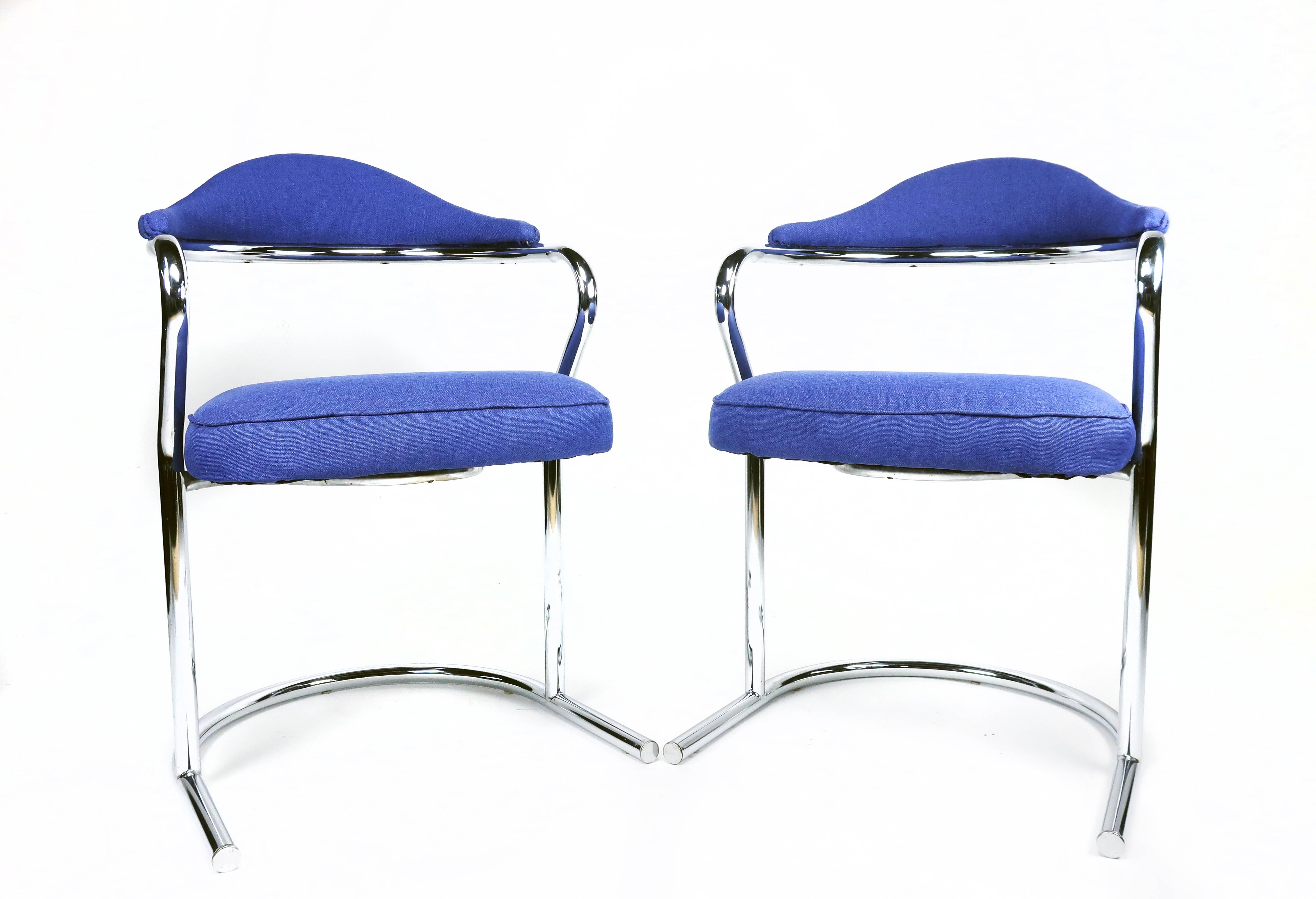 Pair of tubular chrome cantilevered armchairs in the style of Anton Lorenz for Thonet. Designed in the 1930s, these midcentury chairs remain in demand and fit perfectly with today's style trends. Sculpted polished chrome design with a minimal modern
