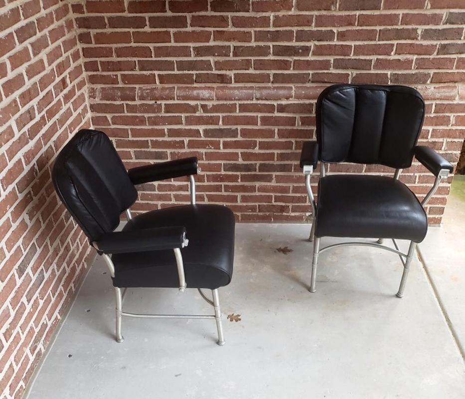 A pair of metal armchairs designed by Warren McArthur (1885-1961) and made by Warren McArthur Corporation for Chrysler headquarter in Chicago between 1946-1948. These chairs feature spun aluminum metal frame, simple and chic with an industrial