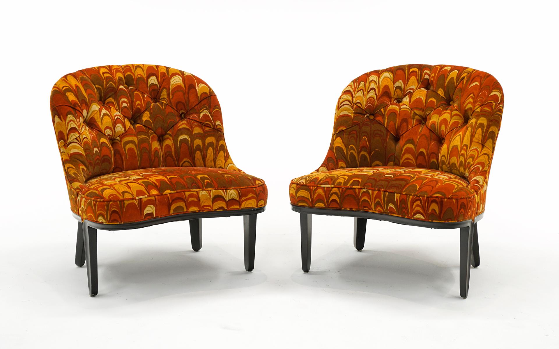 Rare, all original, pair of armless lounge / slipper chairs designed by Edward Wormley for Dunbar.  Both chairs retain the original orange mod swirling fabric in shades of orange designed by Jack Lenor Larsen.  Truly exceptional examples of mid