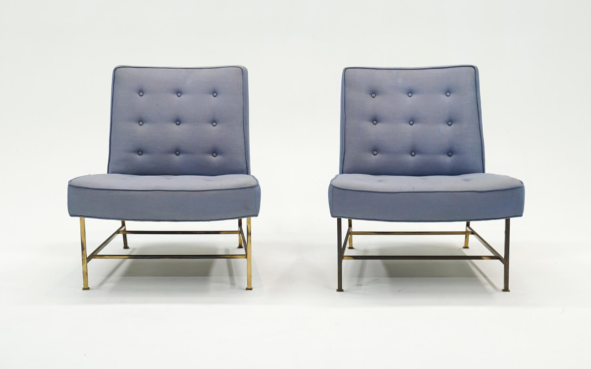 Rare pair of Harvey Probber lounge chairs with brass frames.  All original brass feet are intact.  The original blue upholstery shows wear, stains and imperfections and is priced accordingly for the new owner to upholster to their liking.  These are
