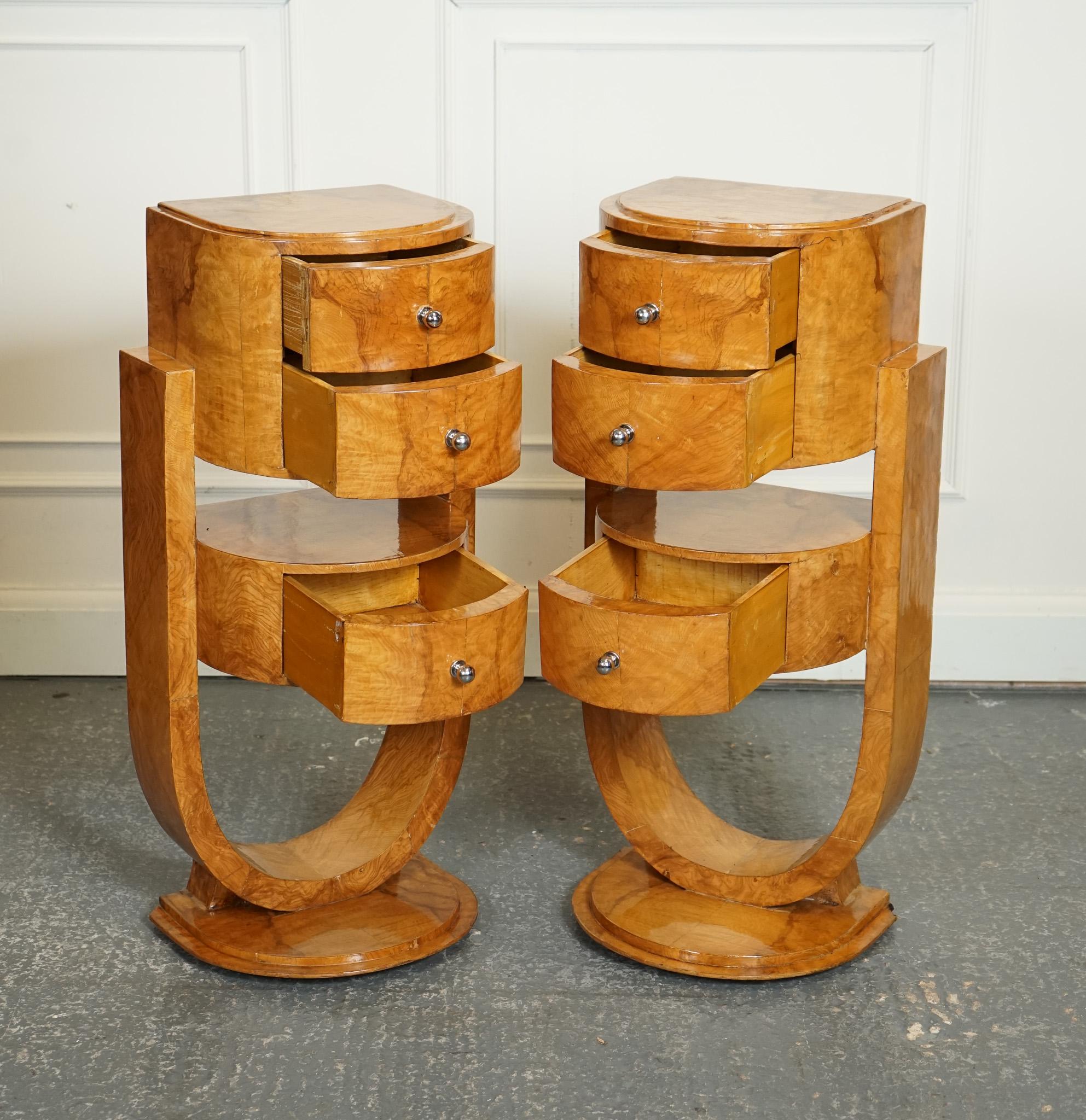 
We are delighted to offer for sale this Pair of Art Deco Style Burr Walnut Bedside Tables.

These pair of Art Deco Style burr walnut veneered on hardwood bedside cabinets nightstands lamp end tables are truly stunning pieces that embody the style