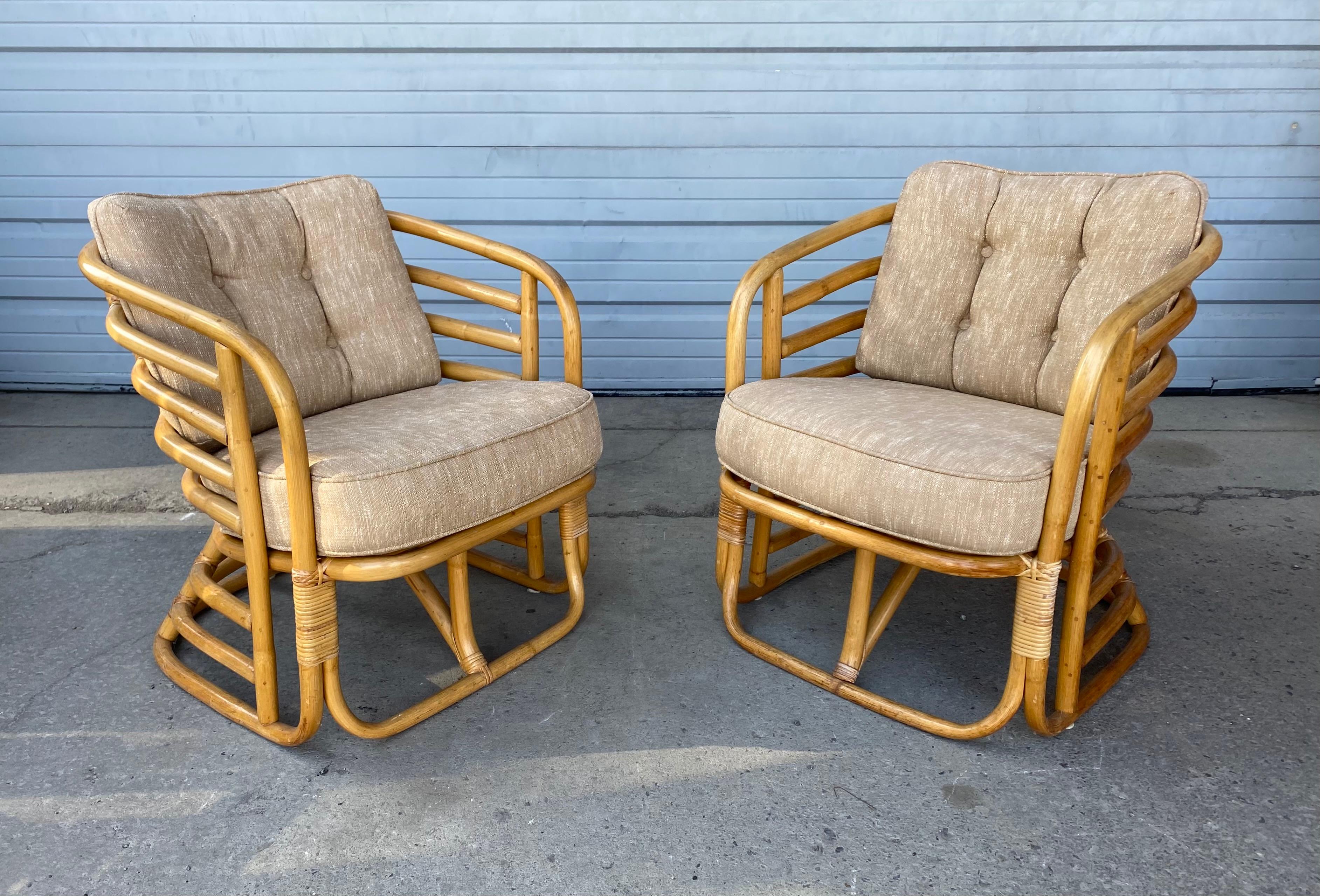 Pair of Art Deco bamboo stylized lounge chairs, attributed to Beverly Hills Rattan. Great pair, wonderful design, proportion, patina. Frames in nice original condition. Seat and back cushion recently replaced, extremely comfortable.