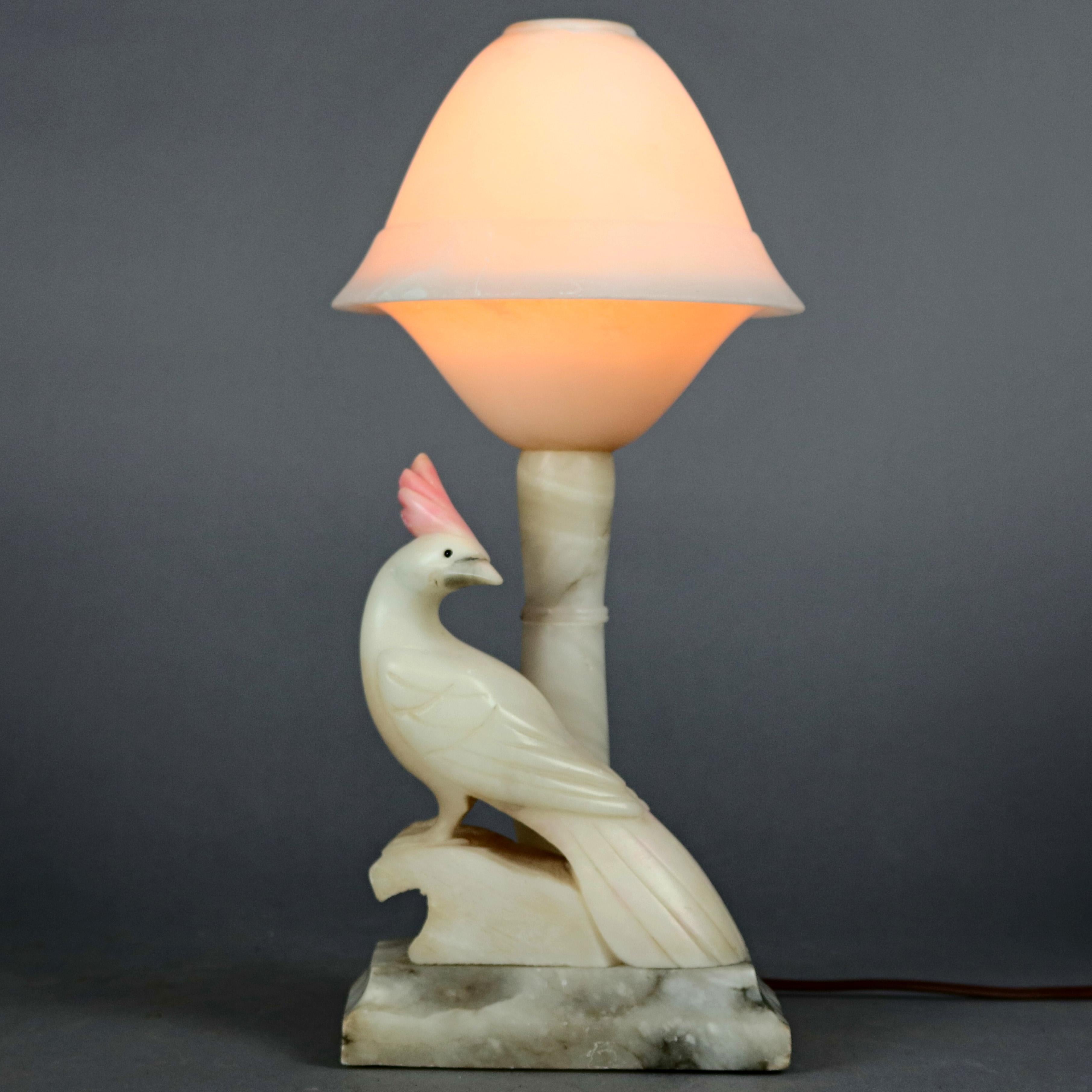 A pair of Art Deco Italian marble and alabaster figural aviary lamps offer two toned carved cockatoo sculptures seated on stepped bases with pole lamps having dome shades, Art Nouveau elements, circa 1930

***DELIVERY NOTICE – Due to COVID-19 we are