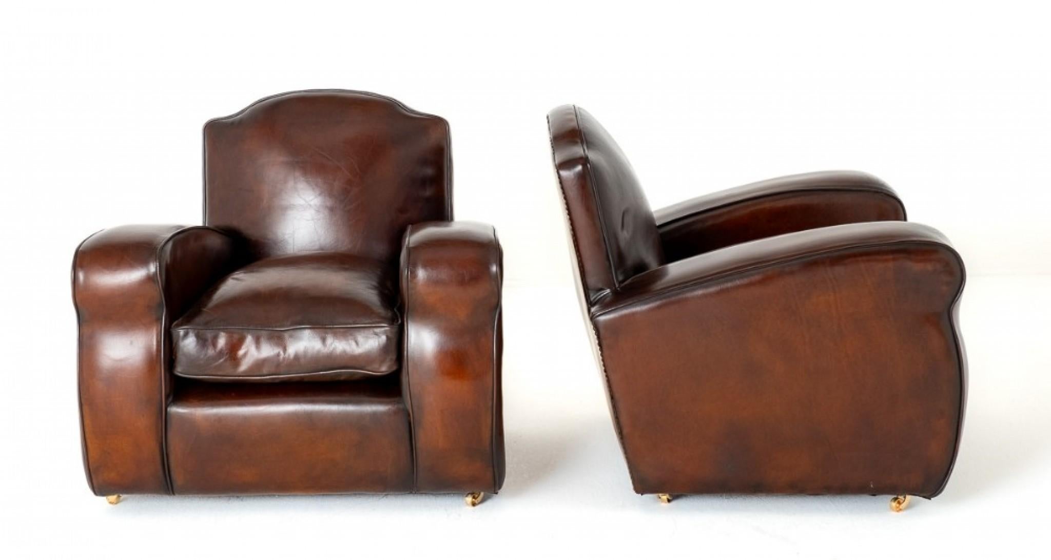 Good Pair of Art Deco Leather Club Chairs.
These Club Chairs Feature Typical Art Deco Wide Shaped Arms and a Stylish Shaped Back.
The Chairs Having a Leather Filled Cushion making them very Comfortable.
The Chairs Being of a Lovely Tobacco