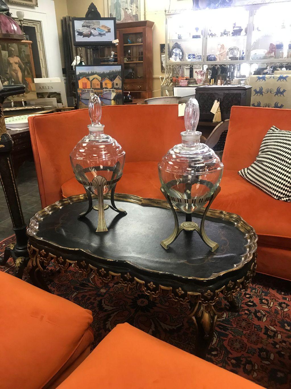 Fabulous pair of Art Deco large teardrop glass vessels each with fitted stoppers and in excellent condition. They are nestled in tripod metal stands. At just under 2 feet tall in stands they are true statement pieces. There are no chips or cracks to