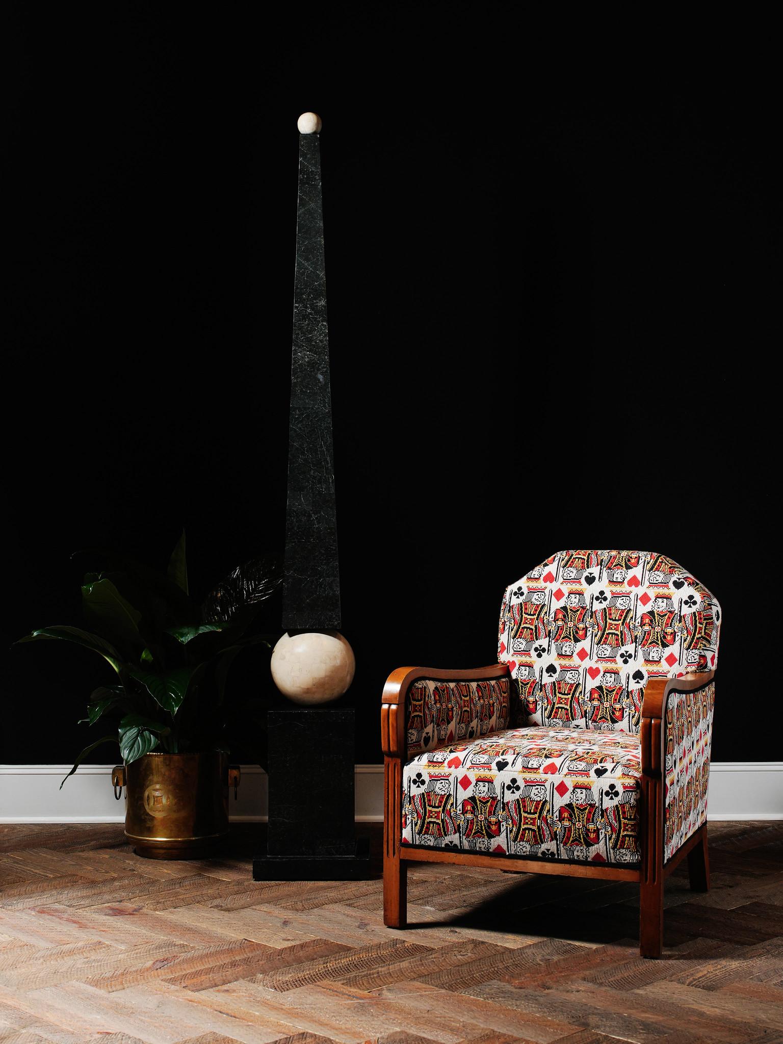 A pair of French Art Deco lounge chairs newly upholstered in Schumacher King Épinglé with black Samuel and Sons trim.

What makes it special?  A playful novelty pattern, King Épinglé adds fun and games to any room. Featuring regal playing card
