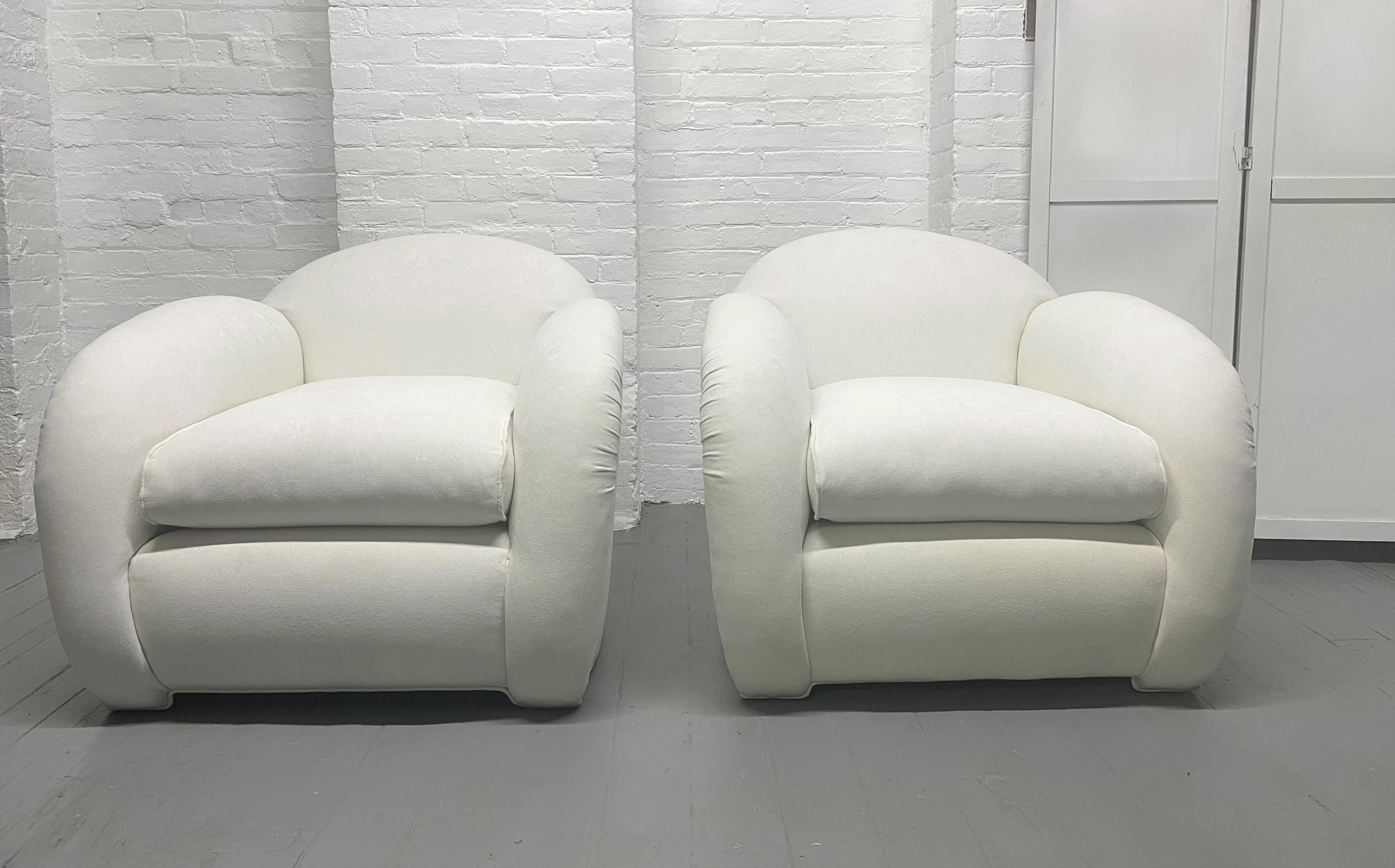 Pair of Art Deco upholstered lounge chairs with a matching ottoman. Cloud chairs. Ottoman measures: 29W x 20D x 17.5H.