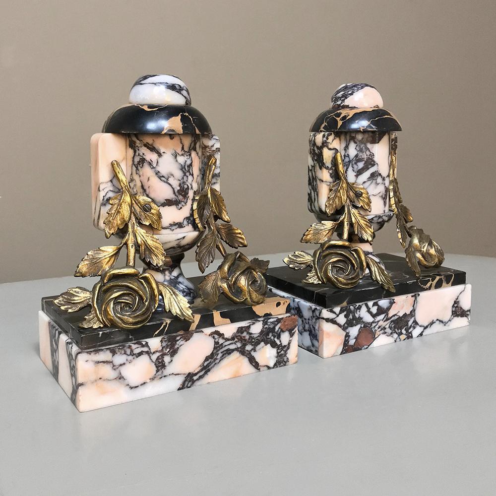 Pair of Art Deco French bronze and marble cassolettes or bookends feature exquisitely veined marble with roses mounted on top in a classic shape that was considered modern at the time!
circa 1920s
Each measures 10 H x 8 W x 5 D.