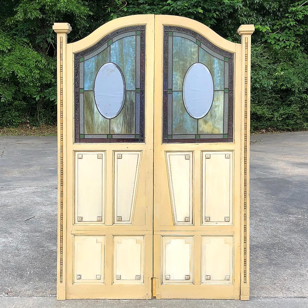 Pair of Art Deco salon doors with stained glass were lovingly salvaged from a commercial establishment in Northern France, and feature amazing detail on both sides, with stained glass showing around the embossed floral urn cameo on one side, and a