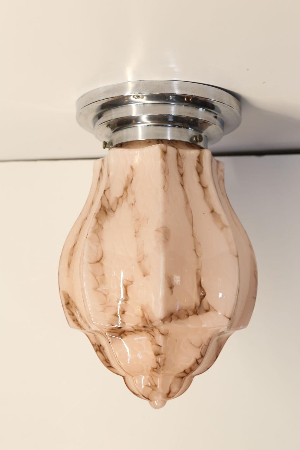 Pair of skyscraper flush mount lights: pinkish blush glass and chrome deco banding. Newly wired for use within the USA using all UL listed parts. Can also serve as stunning wall lights or sconces. The lights are a wonderful pink/blush color.