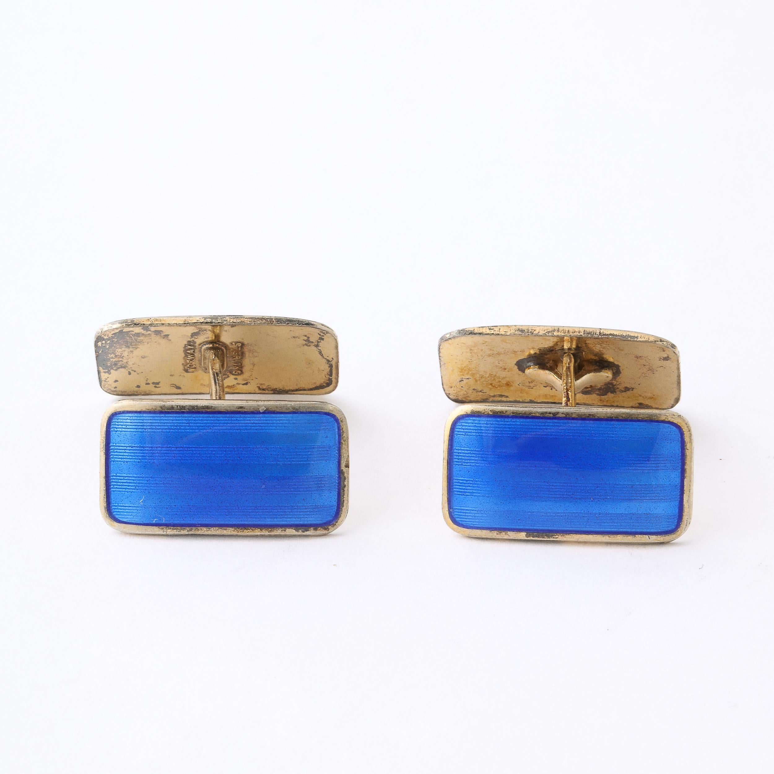 These very elegant pair of Art Deco sterling Silver and lapis blue guilloche enamel cufflinks are by Ansel Holmsen of Sandefjord of Norway .The rectangular cufflinks are double sided ,the design is the same on both sides.The tops are connected with