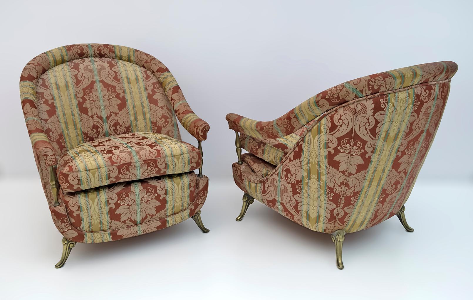 Pair of Art Deco style armchairs, with feet and columns to support the armrests, in brass. The upholstery was redone twenty years ago but is worn and stained, new upholstery is recommended. French production from the 1950s.
