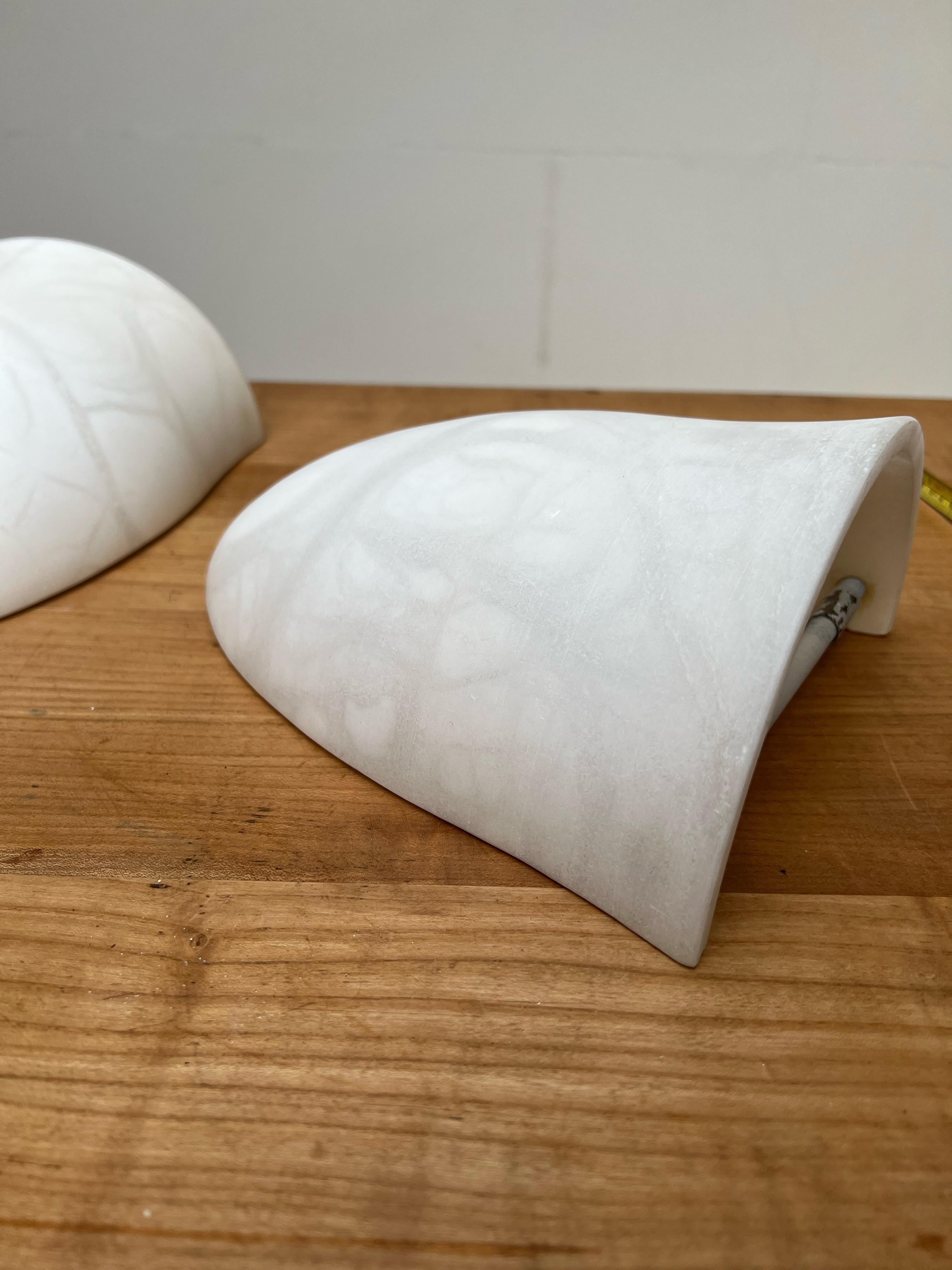 Iron Pair Art Deco Style Midcentury Era Cocoon Shape White Alabaster Wall Sconces For Sale