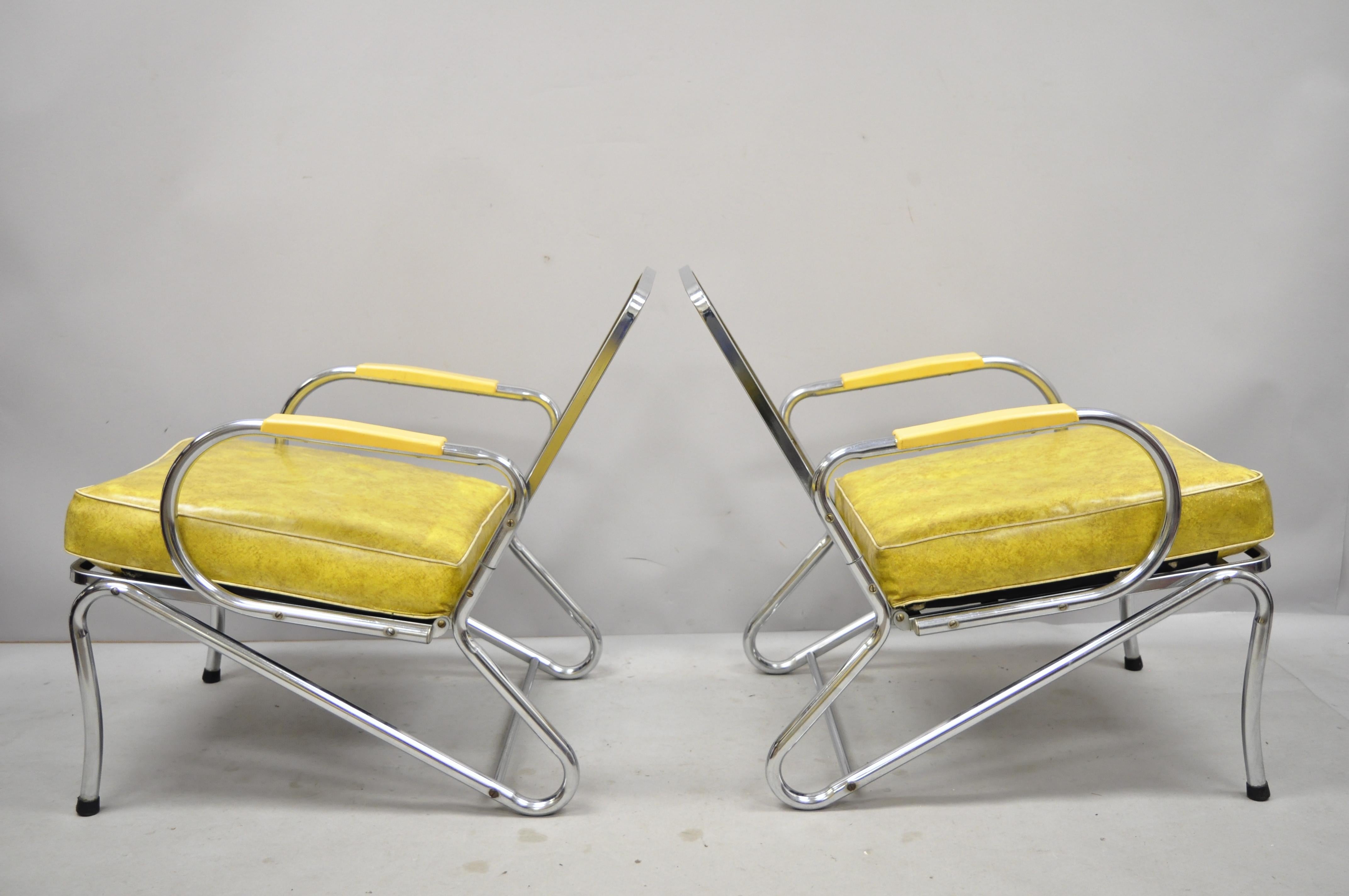 Pair of Art Deco Tubular chrome yellow vinyl club lounge armchairs attributed to Lloyd Mfg. Listing includes original vinyl cushions, metal frames, clean modernist lines, sleek sculptural form. Maker unconfirmed, but possibly by KEM Weber for Lloyd