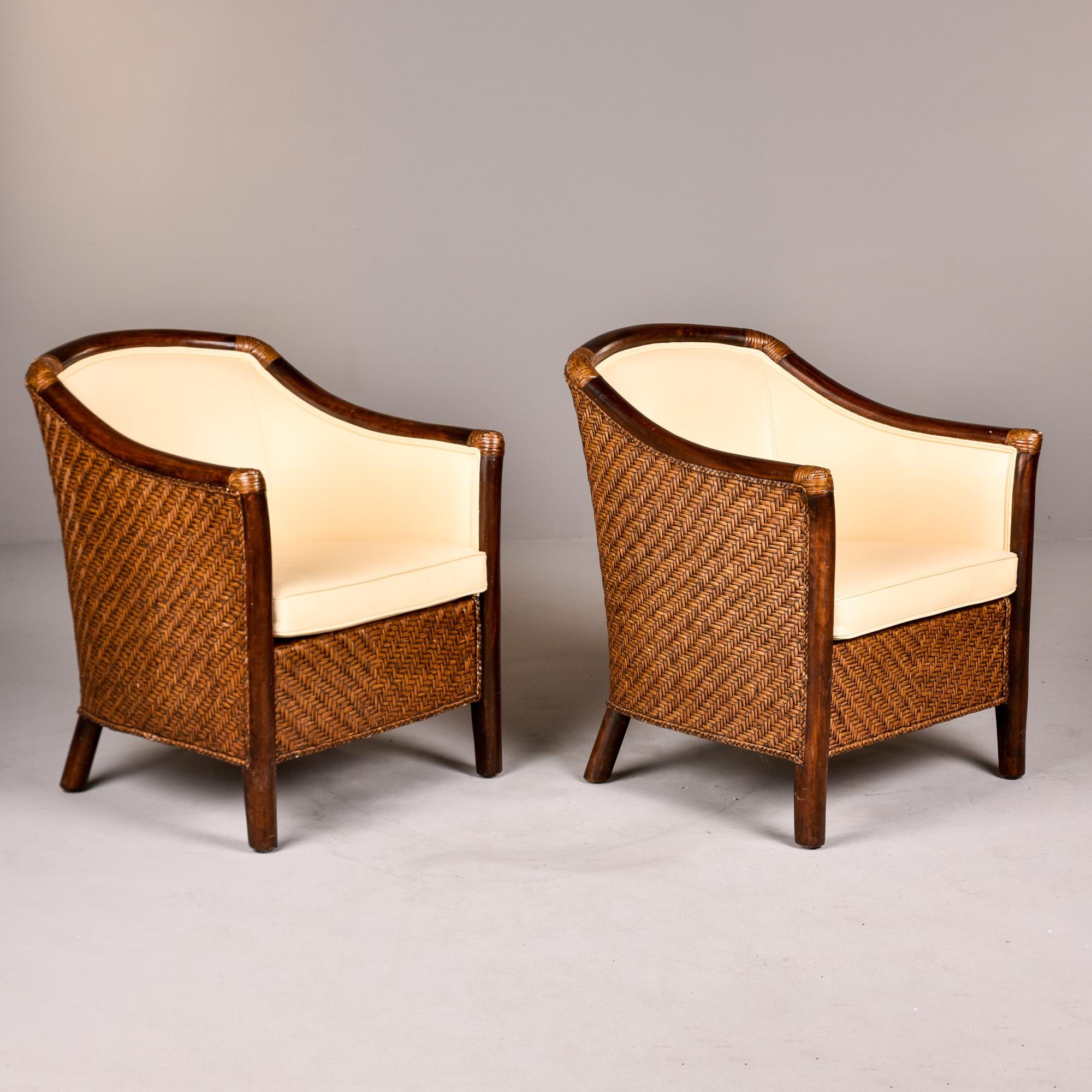 Found in Italy, this pair of wicker and bentwood frame club chairs date from the 1940s. We had them reupholstered in a creamy, ivory colored leather. Unknown maker. Coordinating sofa in same style / upholstery available at the time of this posting