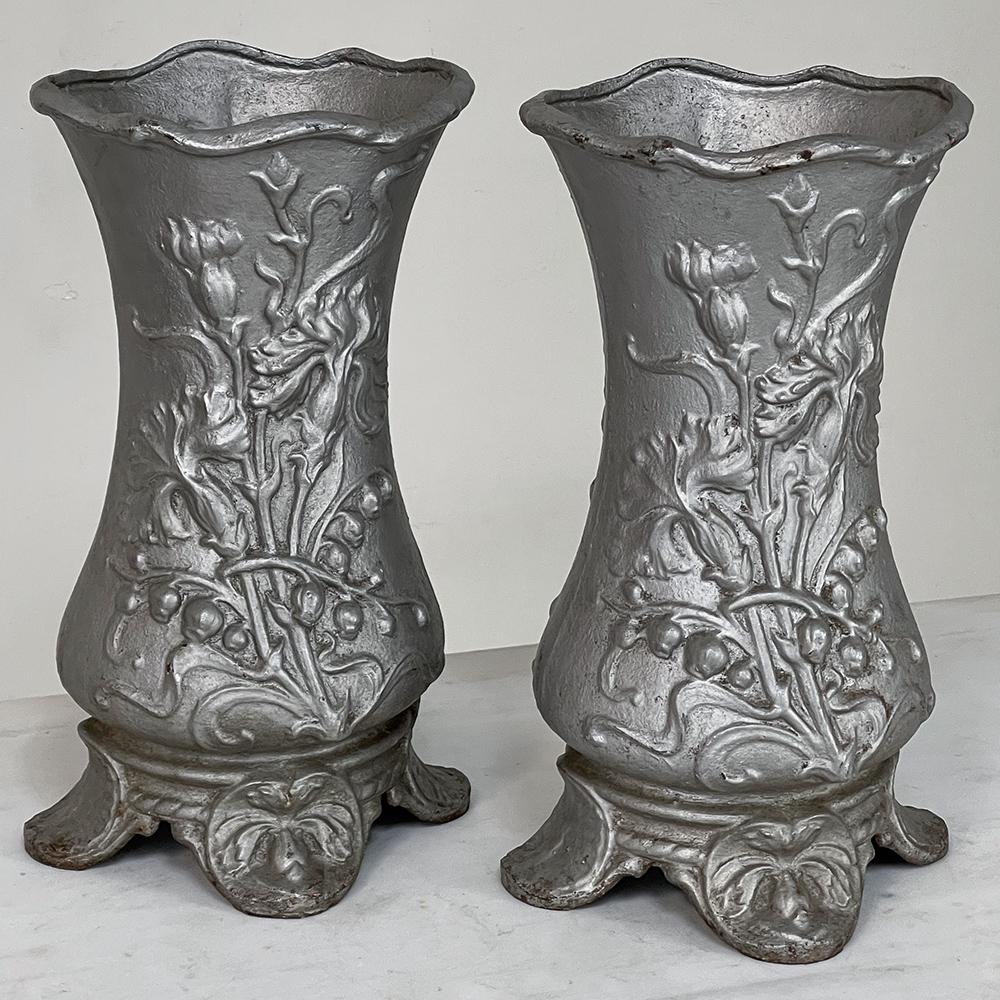 Pair Art Nouveau cast iron painted jardinieres ~ Urns are ready to add timeless symmetry to your decorating! Hand-cast in solid iron with an exquisite Art Nouveau form and embossed floral design on both sides, they work even in front of a mirror or